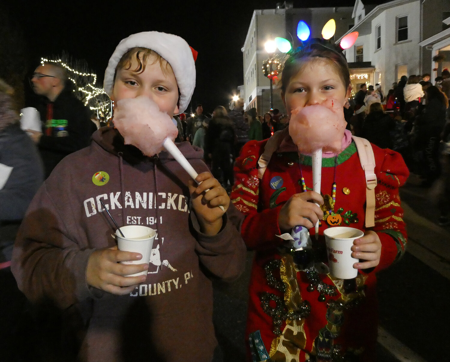 Owen and Abby McDonnell enjoy the cotton candy at Saturday’s holiday event in Perkasie.