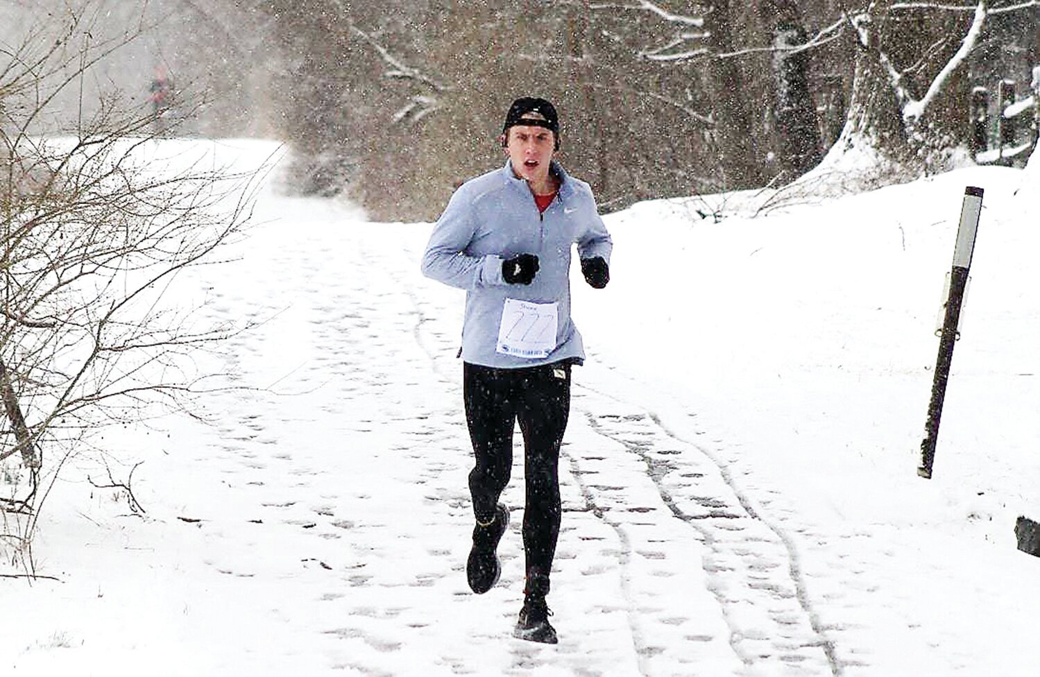 Jamie Gray runs in a Bucks County Roadrunners Club’s Winter Series race at Tyler State Park.