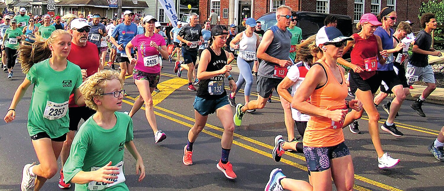 Runners pound the asphalt on Route 202 during the 2023 Chalfont Challenge on June 3 in what would be the final Challenge in the race’s 31-year history.