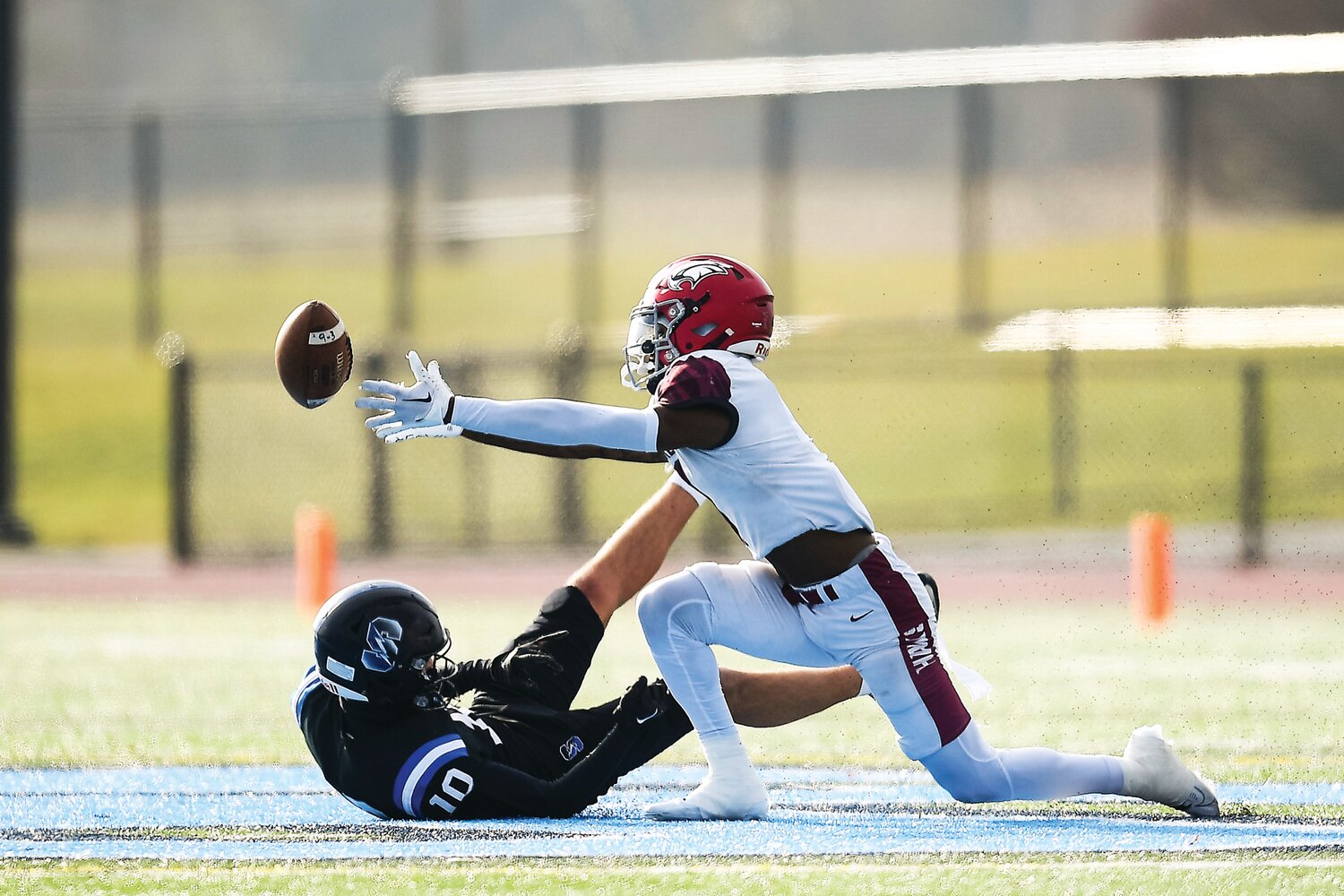 St. Joseph’s Prep’s Omillio Agard makes a diving attempt at an incomplete pass in front of Central Bucks South’s Matt Harmon.