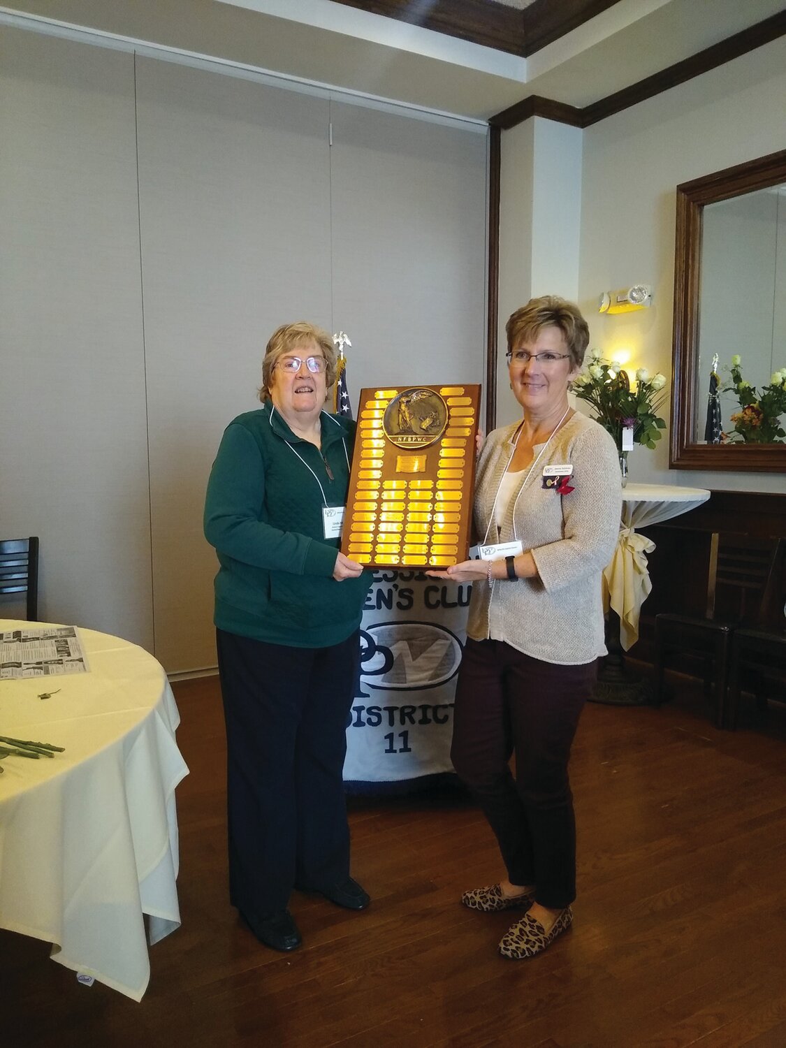 Linda Moskal and Jeanne Schlicher receive the Eleanor Knoke Award at the Fall District Eleven Meeting.