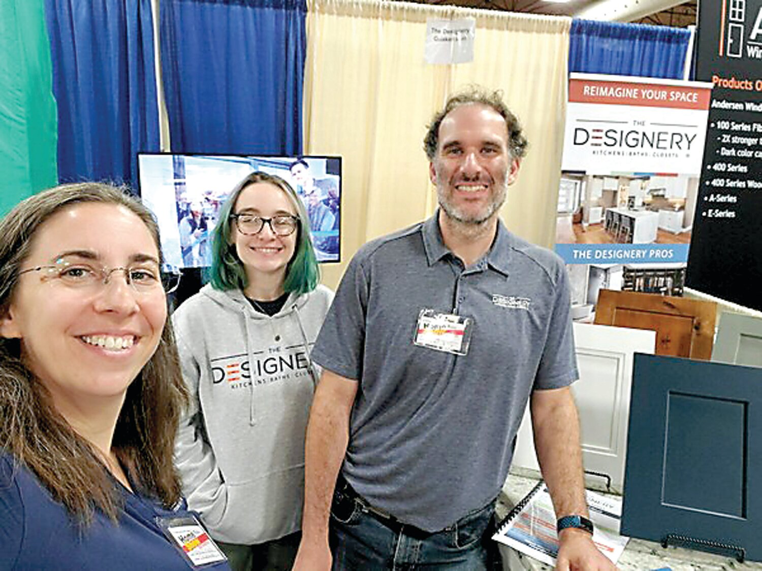 The Designery Quakertown owner Rebecca Merola, left, designer Liz Laurito, center, and store manager Ted Fisher show off the company’s product selection and virtual reality technology at a recent area home show.