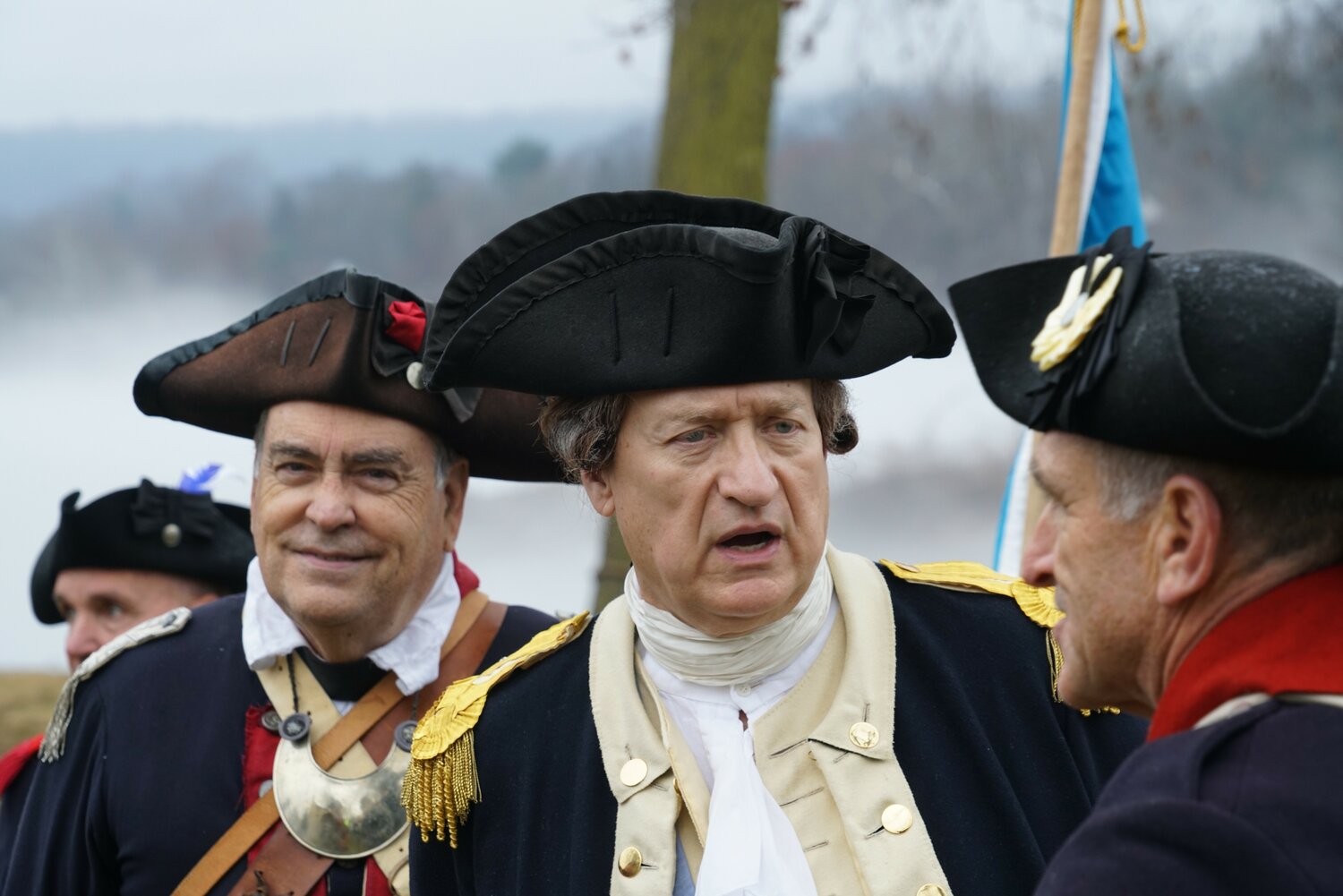 John Godzieba, who has portrayed George Washington at crossing reenactments and other events for many years, speaks to a fellow reenactor Sunday.