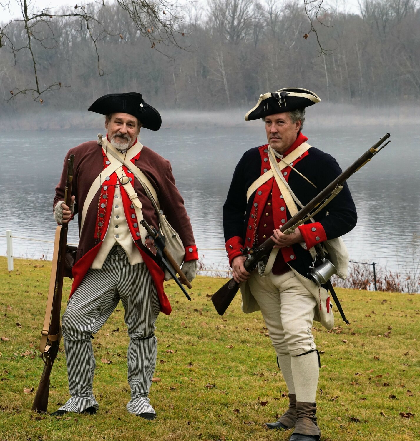 Gary Hellman and Randell Spackman stand on the shores of the Delaware River during Sunday’s reenactment of George Washington’s famous 1776 river crossing.