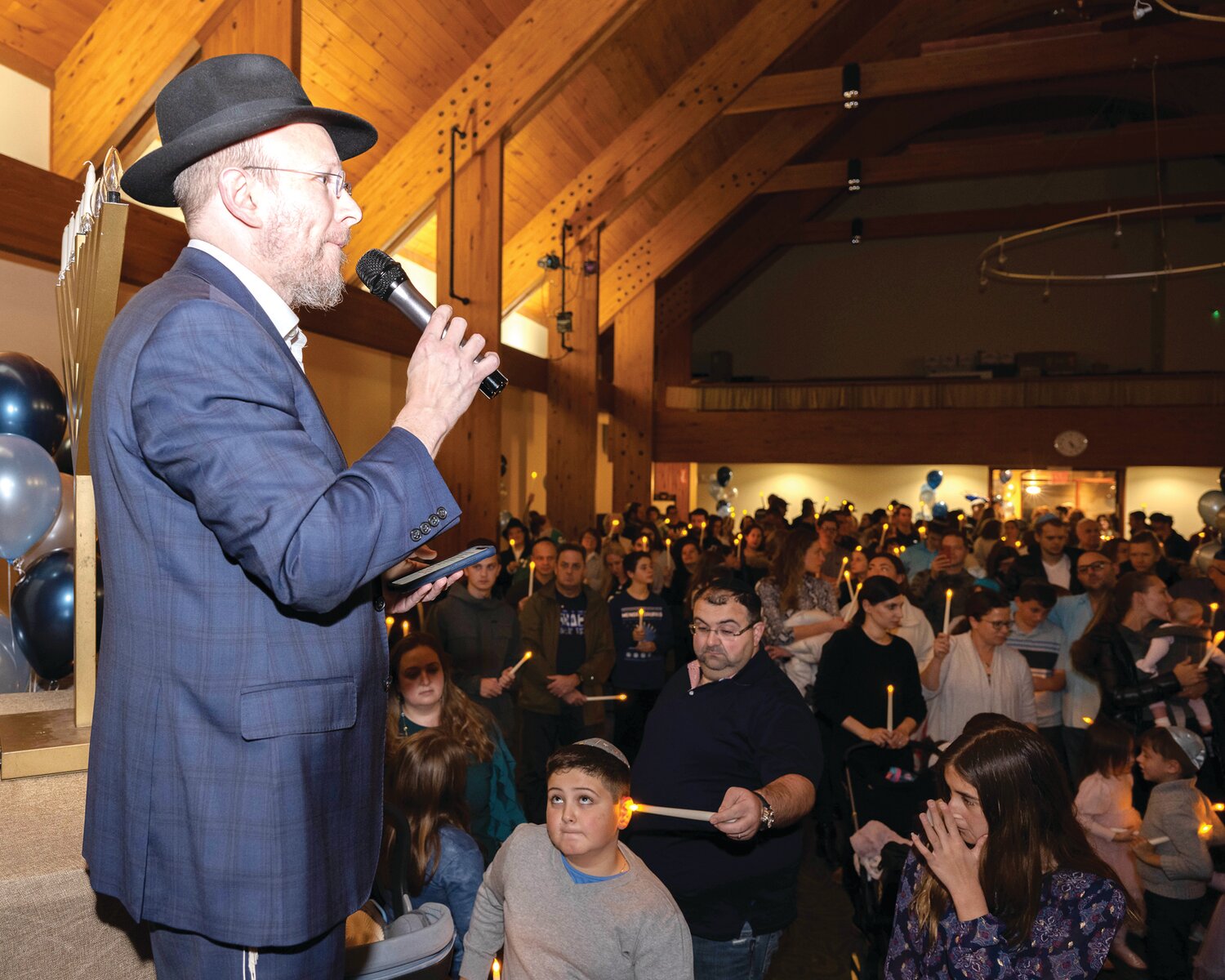 Rabbi Aryeh Weinstein addresses the crowd at the Family Chanukah Celebration, hosted by Lubavitch of Bucks County.