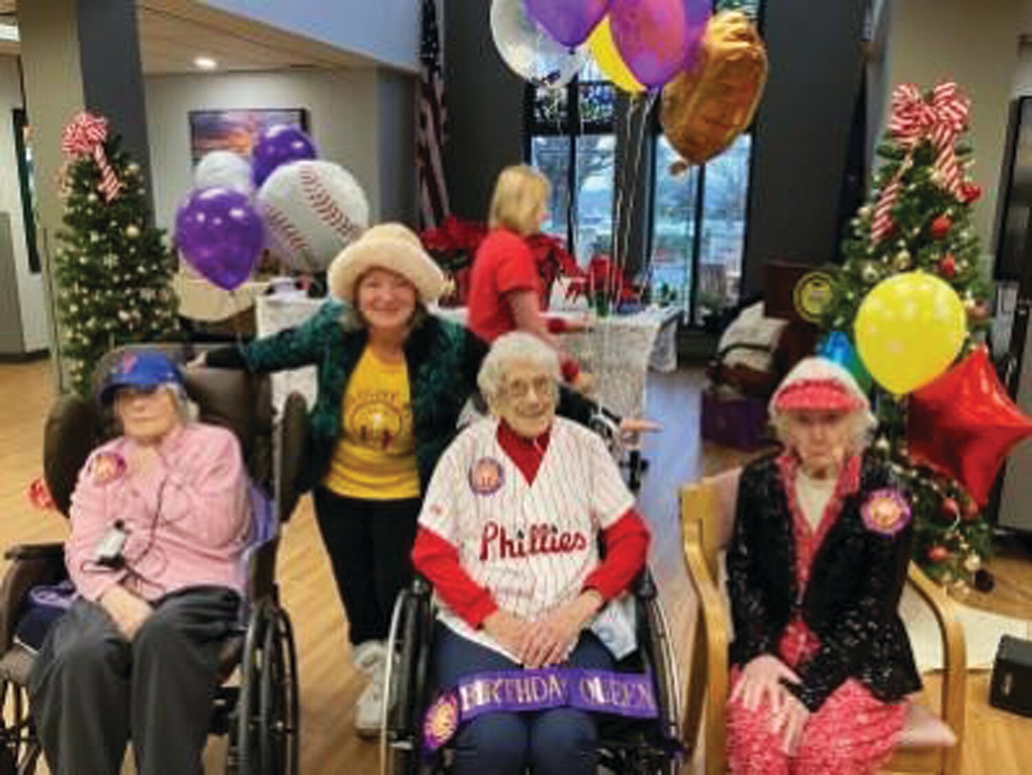 Three Neshaminy Manor residents celebrated their 103rd birthdays last week with a Twilight Wish Foundation wish to have a visit from the Phillie Phanatic. From left, Emma Ventresca, Cass Forkin, founder and chairwoman of Twilight Wish, Esther Welch and Ann Nieswander.