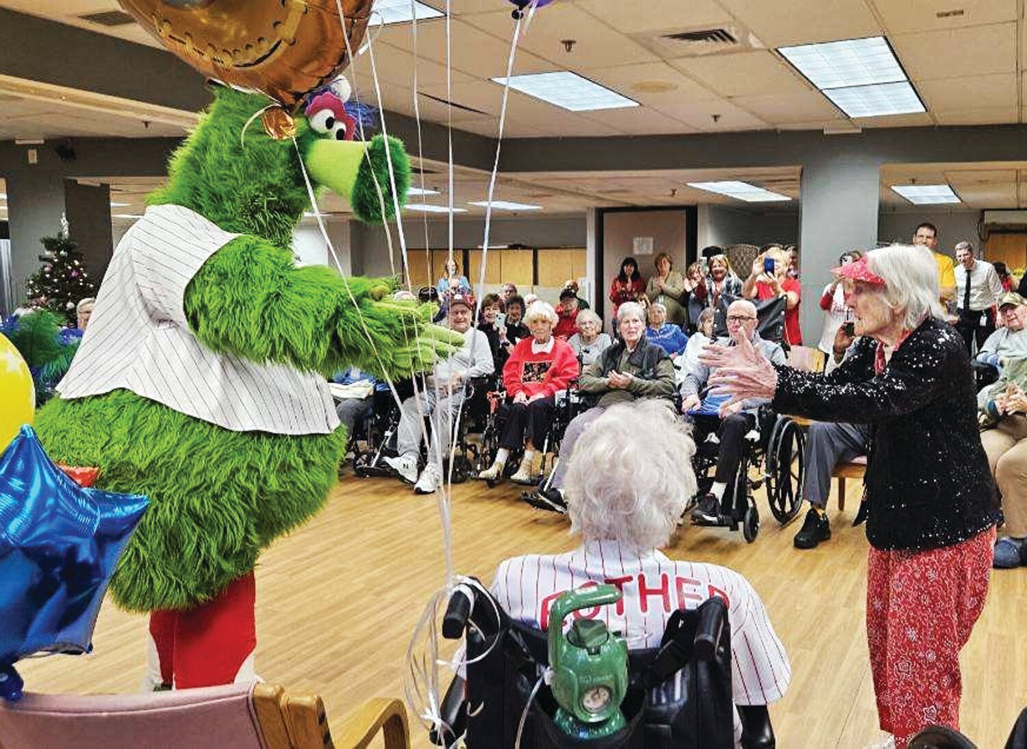Ann Nieswander takes to the dance floor with the Phillie Phanatic at Neshaminy Manor this month to mark her 103rd birthday. Two other residents also reached the remarkable milestone this year.