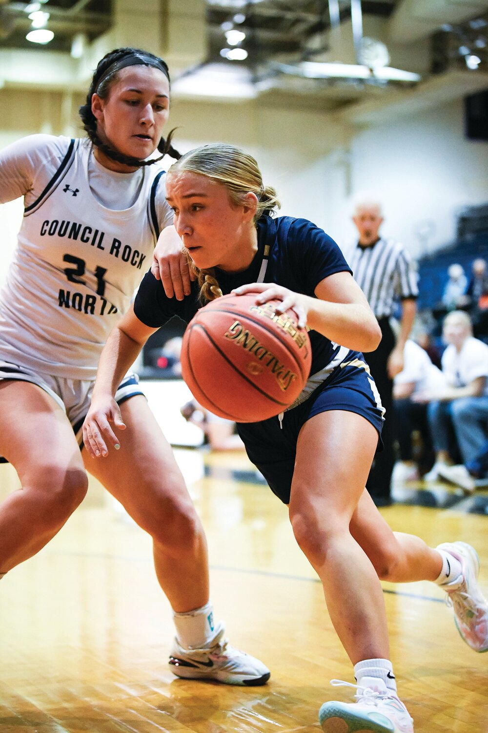 Council Rock South’s Sarah Freeman drives to the basket around Council Rock North’s Delaney McCaffery.