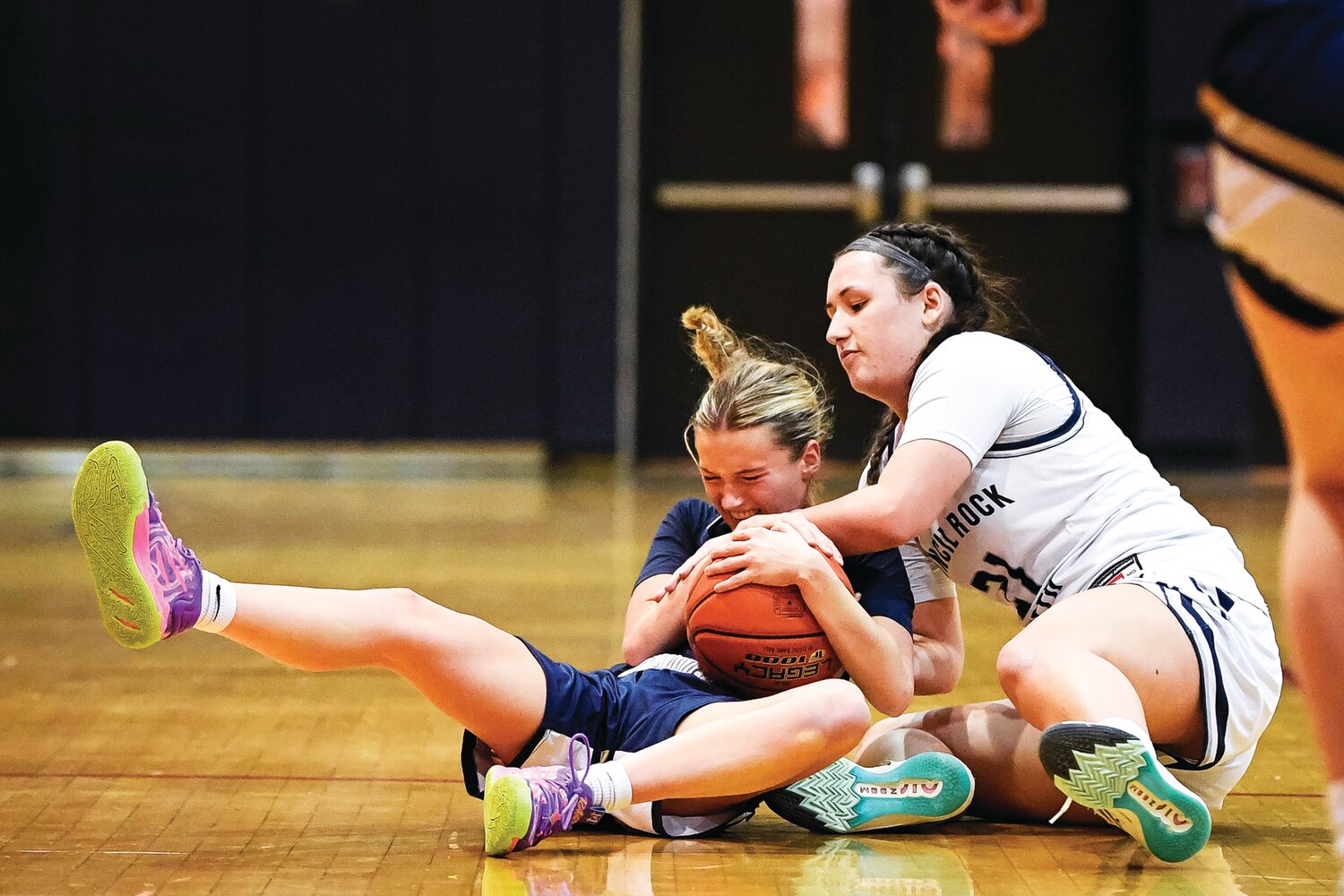 Council Rock South’s Lily Bross wrestles a loose ball away from Council Rock North’s Delaney McCaffery.