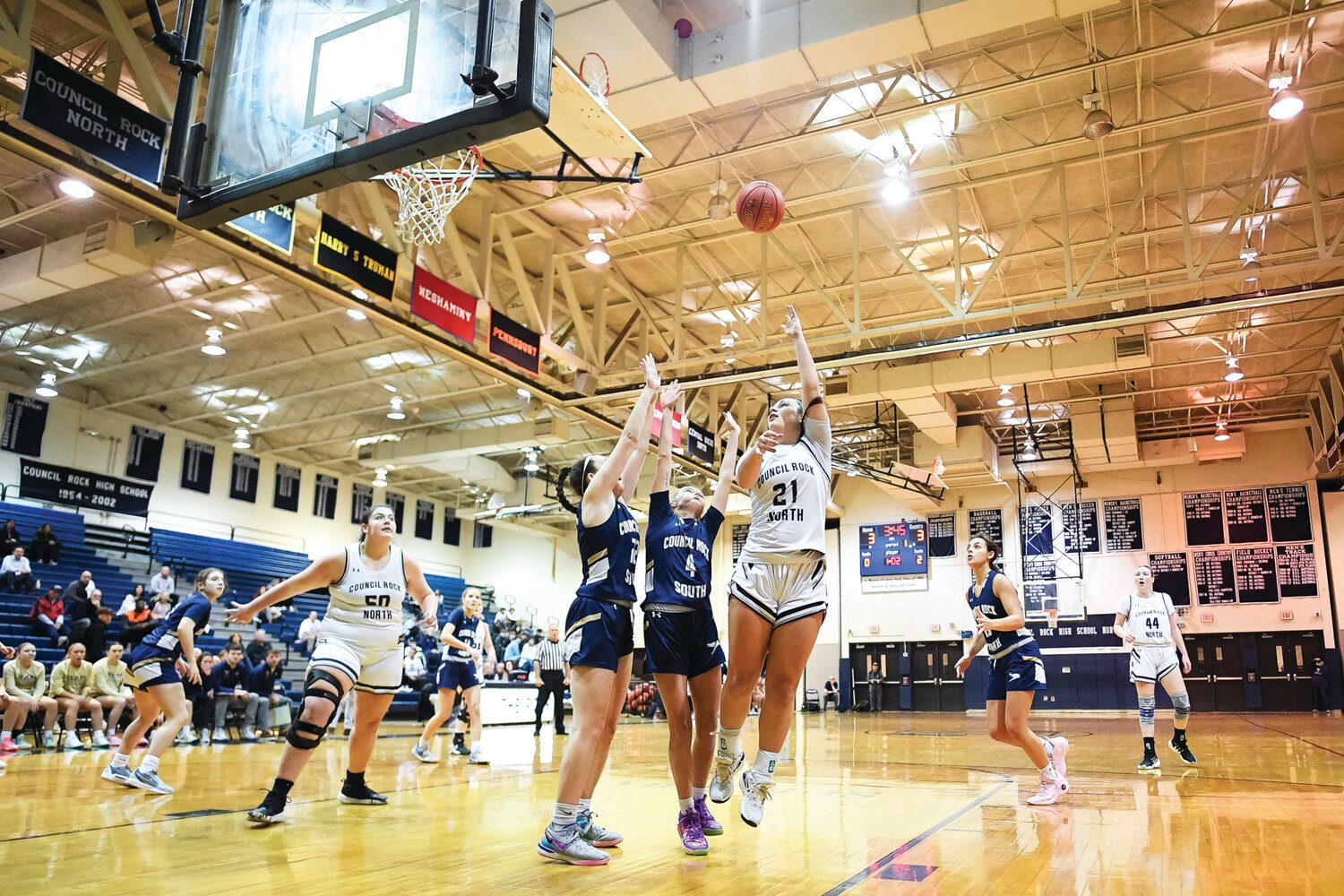 Council Rock North’s Delaney McCaffery launches a hook shot over the double team of Council Rock South’s Fiona Reckner and Lily Bross.