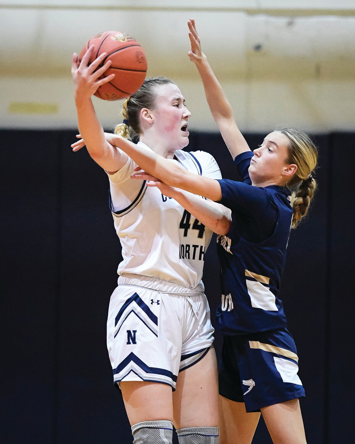 Council Rock North’s Ruth O’Keeffe looks to pass around the close defense of Council Rock South’s Lily Bross.