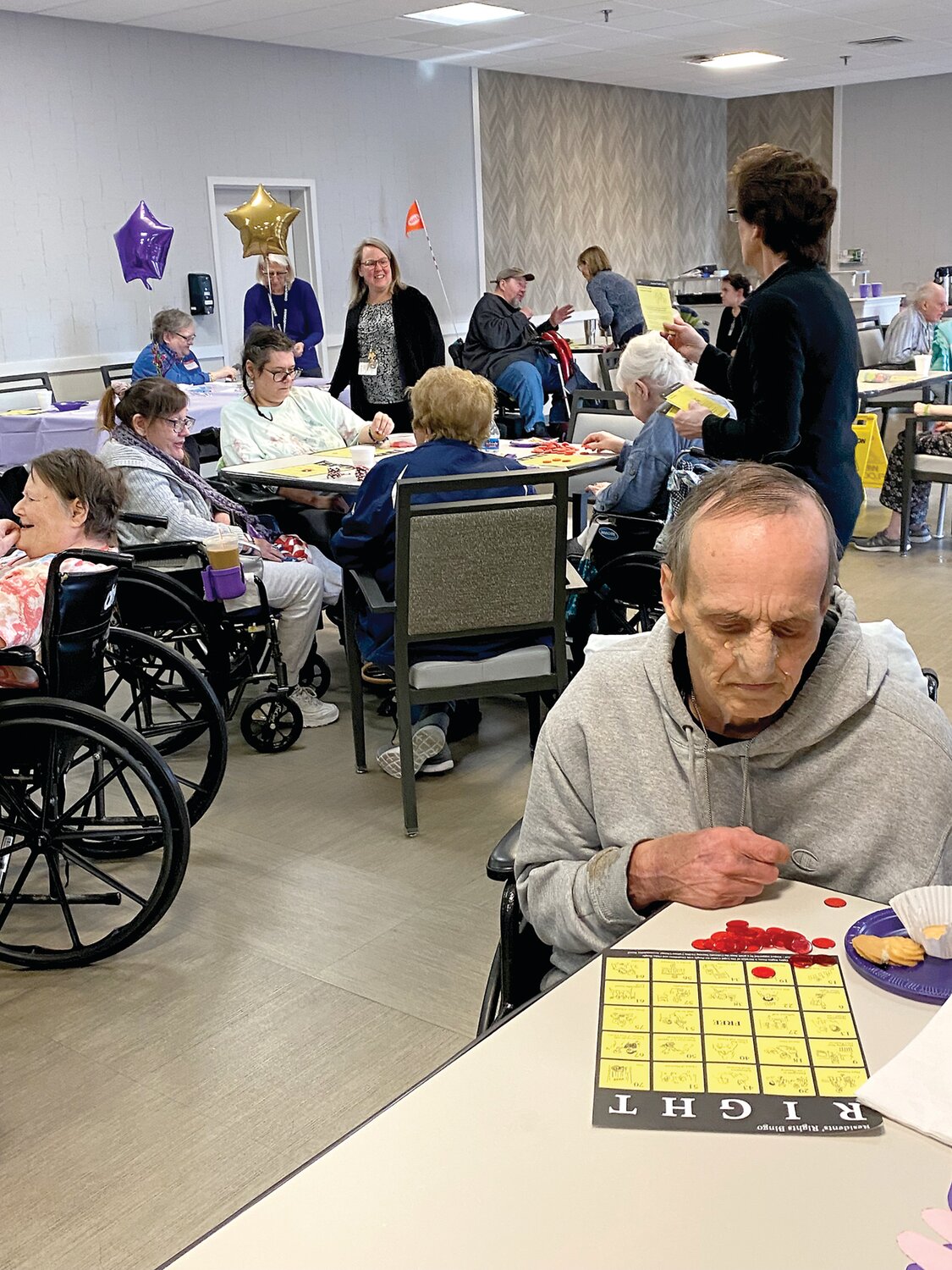 Fredrick Yeager joins other residents and staff in a game of Resident Rights Bingo.