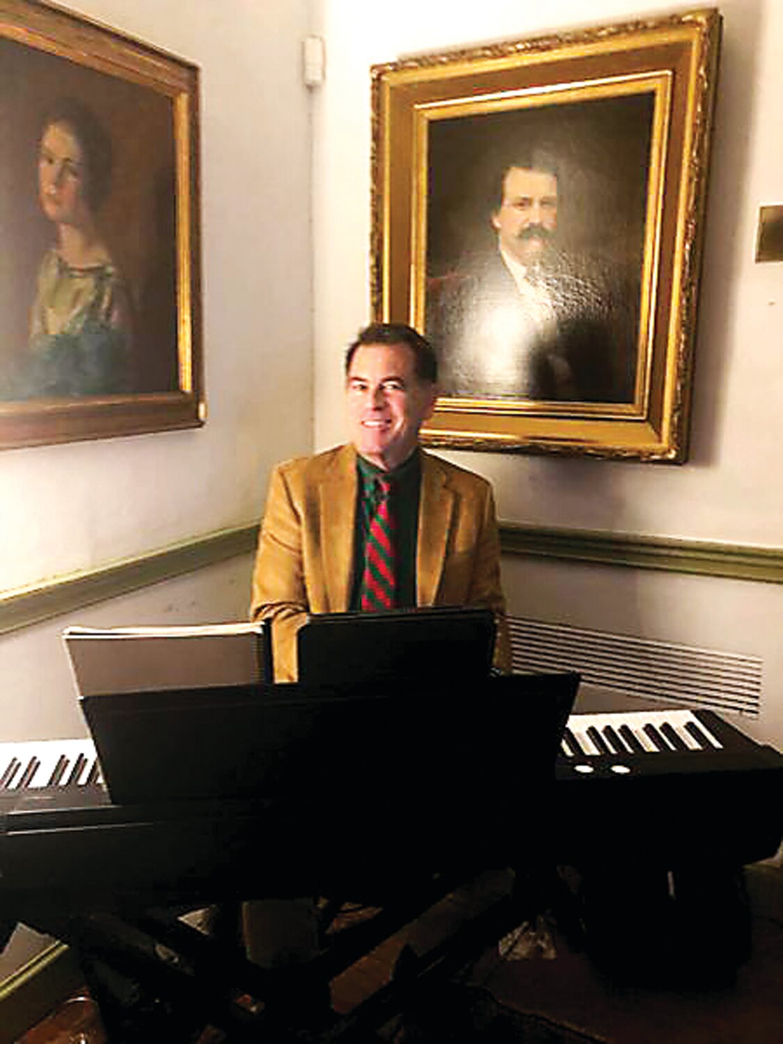 Adding to the holiday cheer at the Parry Mansion Museum on Dec. 3, Bob Egan entertained the crowd with traditional holiday carols and songs.