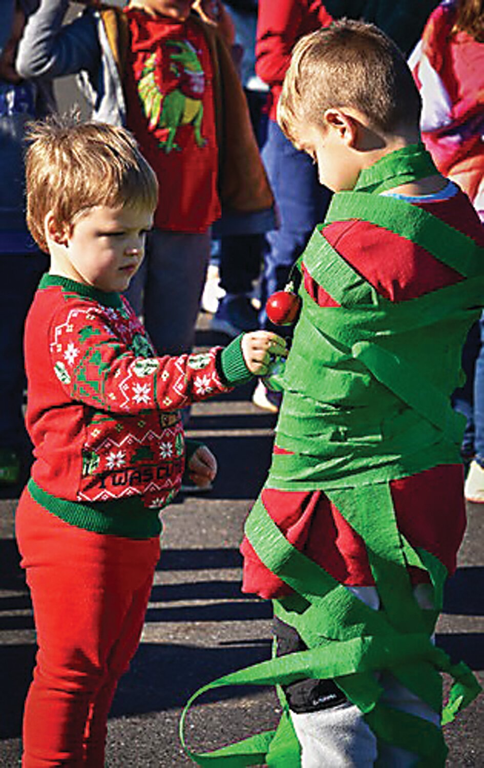 Children get decorated at the annual Candy Cane Hunt on the grounds of Springtown Rod & Gun Club in Springfield Township on Saturday Dec. 16. Organized and hosted by Mary Riexinger and sponsored by local businesses and families, the free event is in its third year.