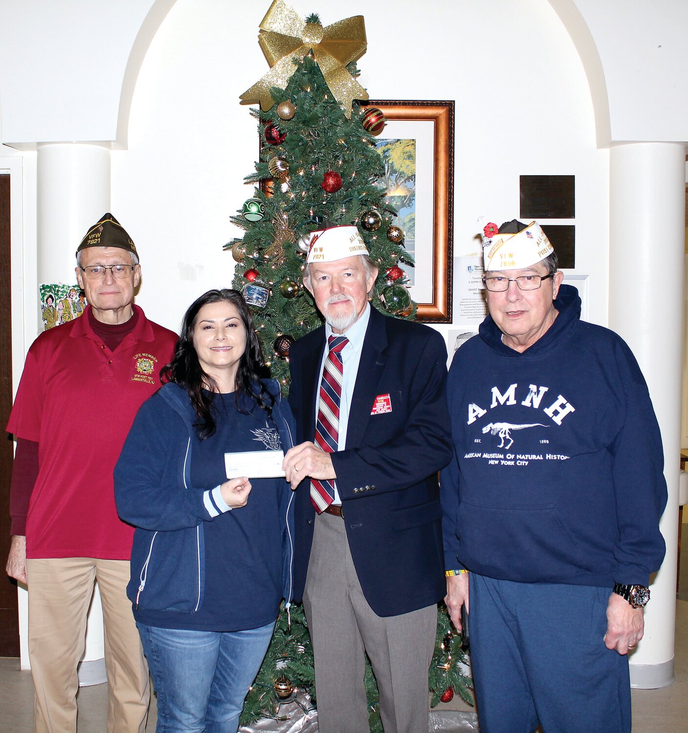 VFW District 19 Commander Georg Hambach presents a check for $2,075 to Cheryl Bade, supervisor of human services for the Veterans Haven North facility in Glen Gardner, N.J. They are flanked by District Quartermaster John Cuprzinski, left, and District Senior Vice Commander Gerry Cadwaller, right.