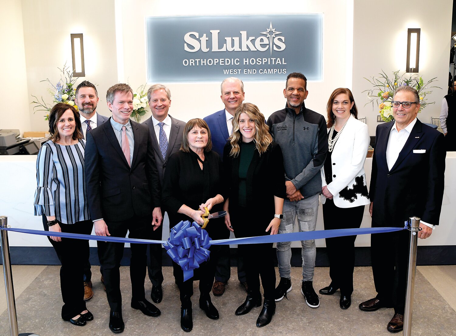 At the ribbon cutting for St. Luke’s Orthopedic Hospital in Allentown are, from left, Christine Lewbart, director of surgical services; Trevor Micklos, president of Warren Campus; Bill Moyer, West region president; Joel Fagerstrom, chief operating officer; Maryanne Sontak, St. Luke’s orthopedic patient; Dr. Douglas Lundy, chairman of orthopedics; Jessica Kamensky, orthopedic service line administrator; Andre Reed, pro football Hall of Famer; Keri Angelozzi, vice president of patient care; and Richard A. Anderson, president & CEO.