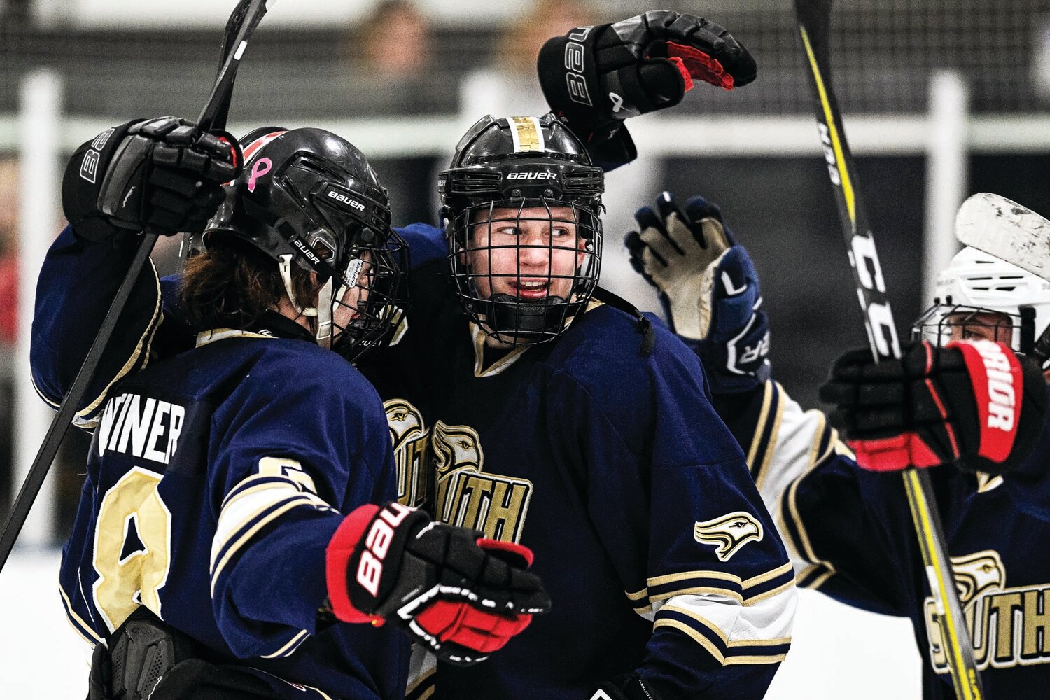 Council Rock South’s Jake Maurer celebrates a second period goal by Kevin Koles with Jake Weiner, making the score 3-2.