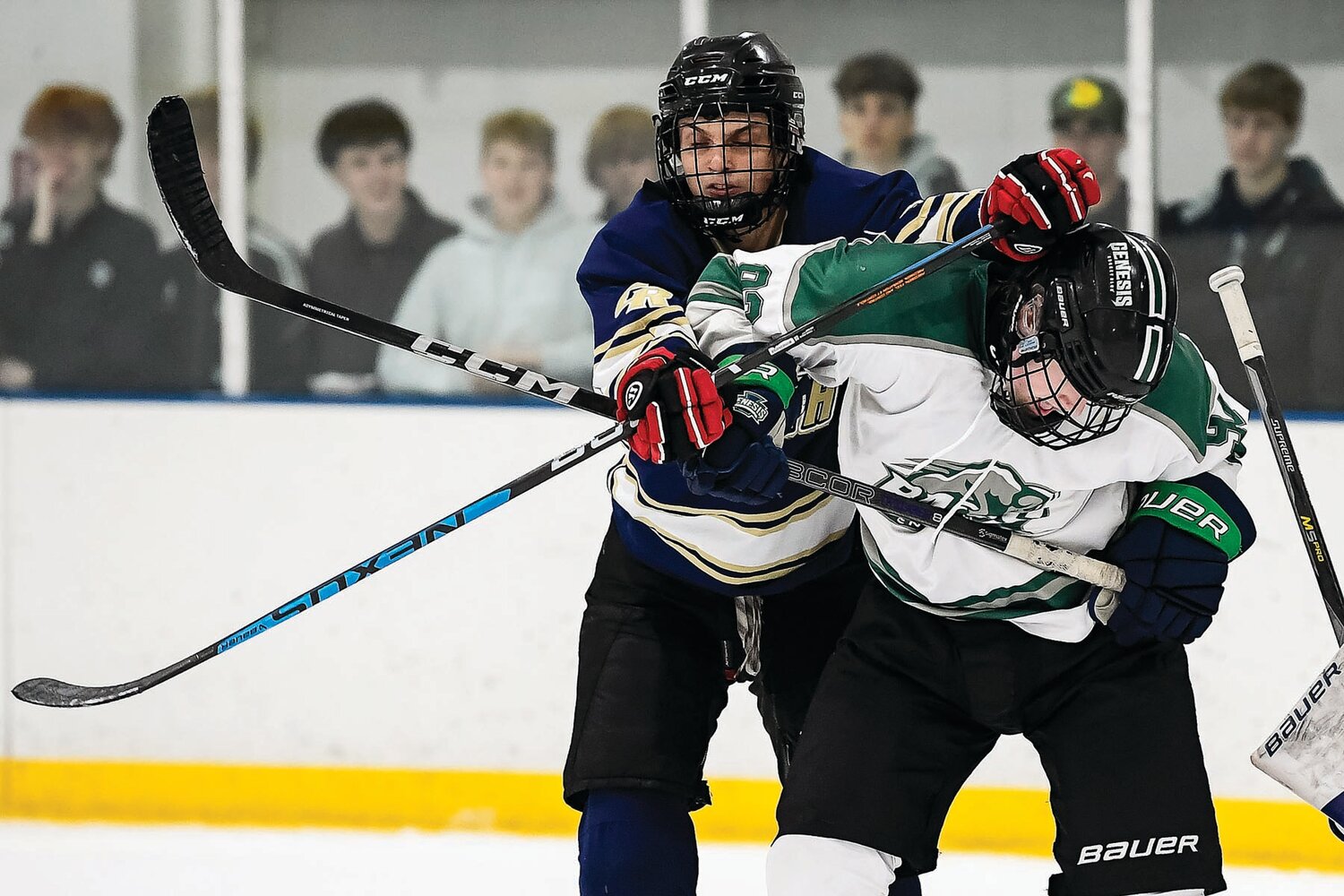 Pennridge’s Nathan McKean gets a cross-check to the back from Council Rock South’s Ilya Kudzinau in the third period.
