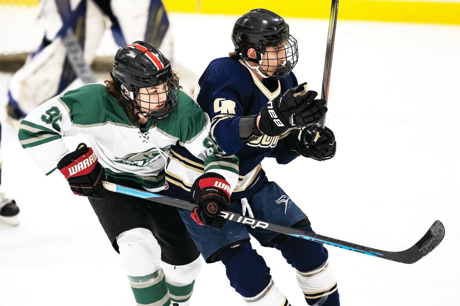 Pennridge’s Nicholas Young and Council Rock South’s Blaize Pepe cross paths going for a loose puck in the first period.