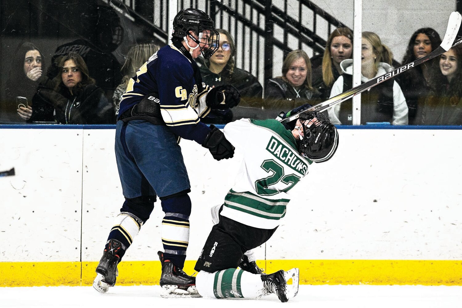 Pennridge’s Shane Dachowski gets a stick to head while battling Council Rock South’s Illia Mukhin in the corner during the third period.