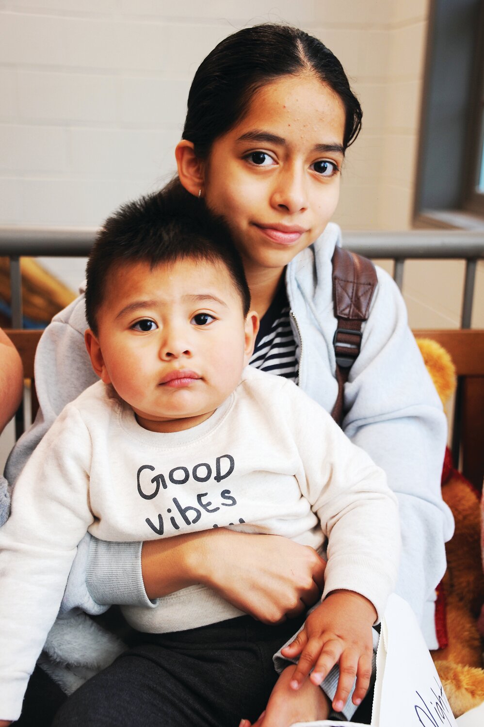 Andrea and her brother wait patiently for the party to begin.