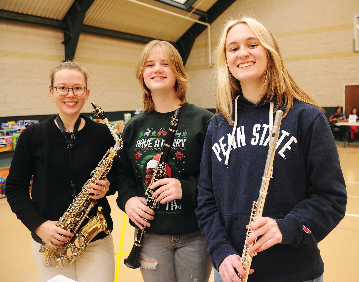 Aline Maurer, Jessica St. John and Laura Houghton provide music.