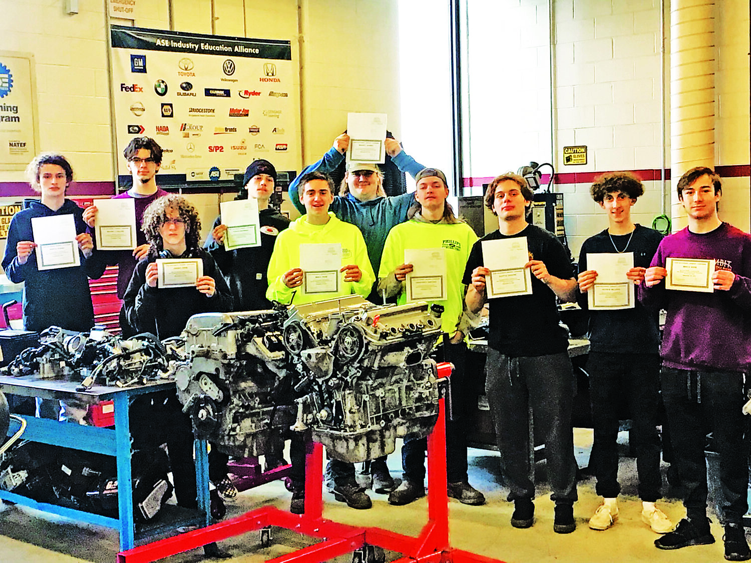 Middle Bucks Institute of Technology’s Automotive Technology program seniors in the Class of 2022 hold up their Automotive Service Excellence (ASE) Environmental Protection Act-(EPA) 609 certification for Refrigerant Recovery and Recycling for Motor Vehicle Air Conditioning (MVAC) Service.