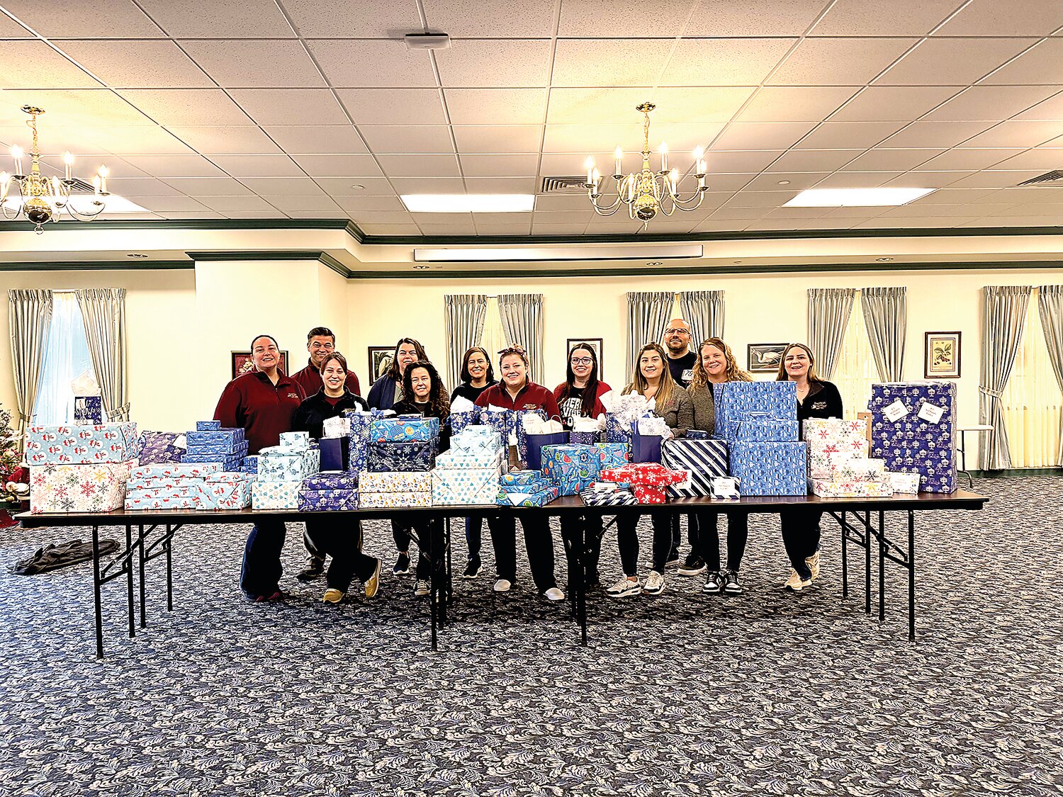 Volunteers shopped, wrapped, and distributed hundreds of gifts for local families.