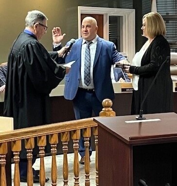 Chuck Heybach takes the oath of office Tuesday evening as a new member of the Warminster Township Board of Supervisors.