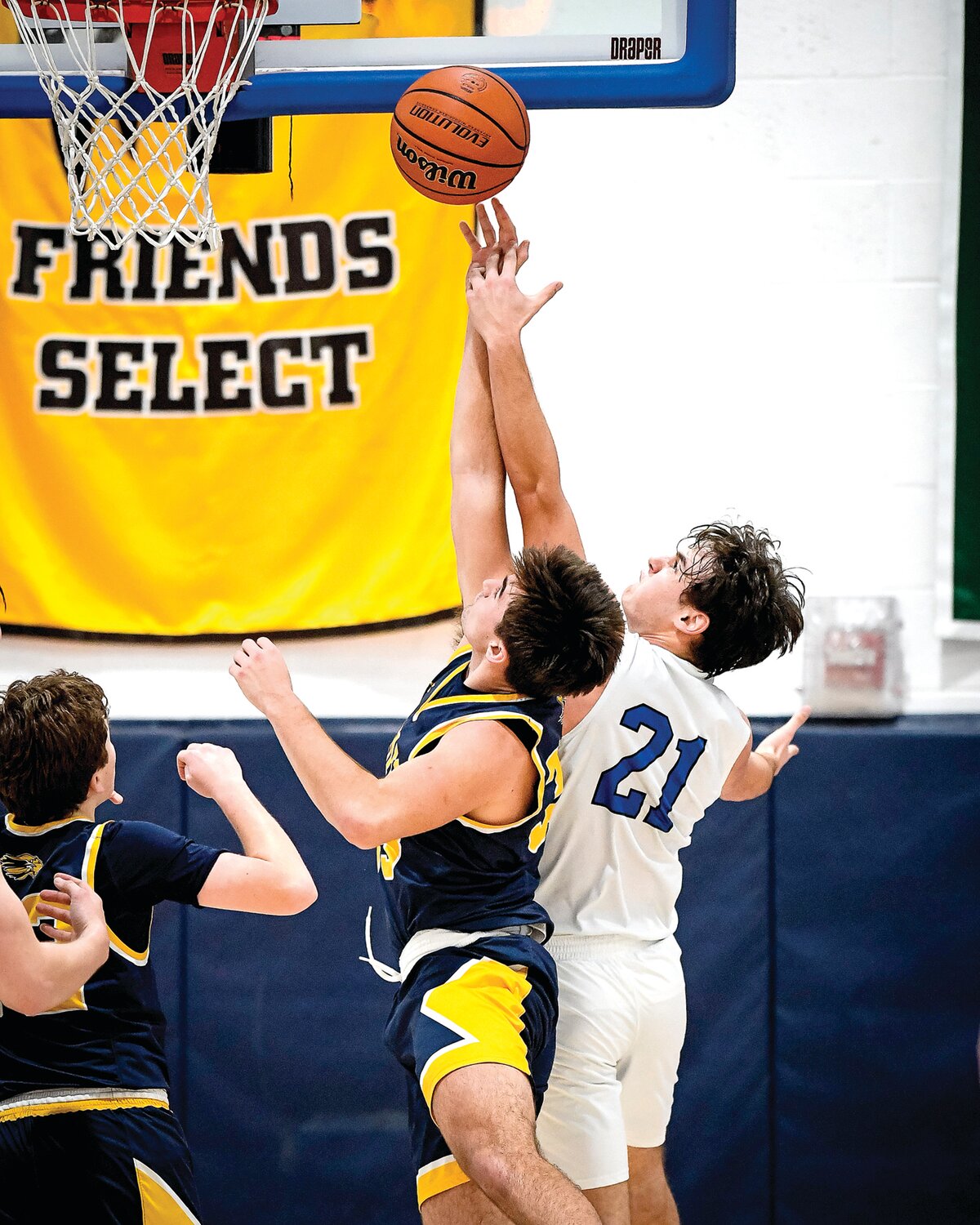 New Hope-Solebury’s Dylan Fitzgerald and  Jack M. Barrack Hebrew Academy’s Edo Aharoni battle under the basket for a rebound.