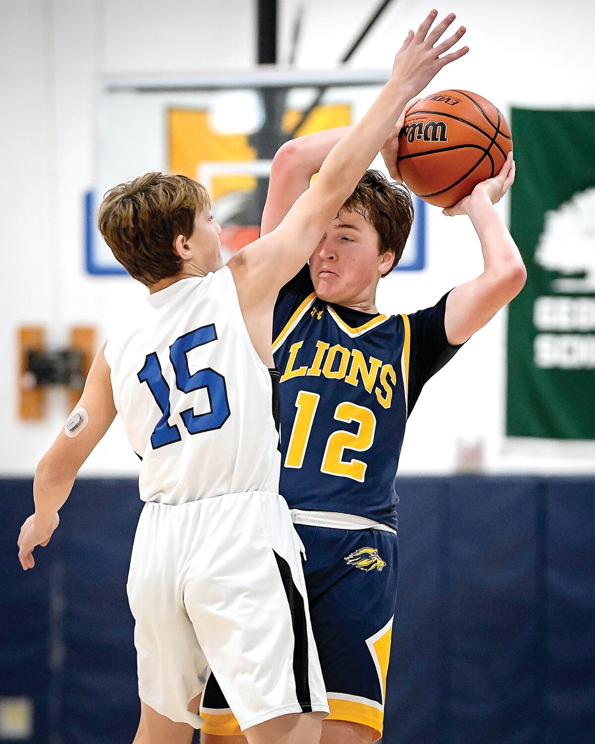New Hope-Solebury’s John Nettles takes an elbow to the head while trying to make a pass around Jack M. Barrack Hebrew Academy’s Lev Zilberberg.