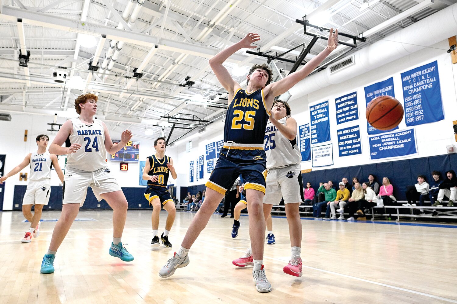 New Hope-Solebury’s Nicholas Rieder loses control of a rebound in front of Jack M. Barrack Hebrew Academy’s Max Shapiro.