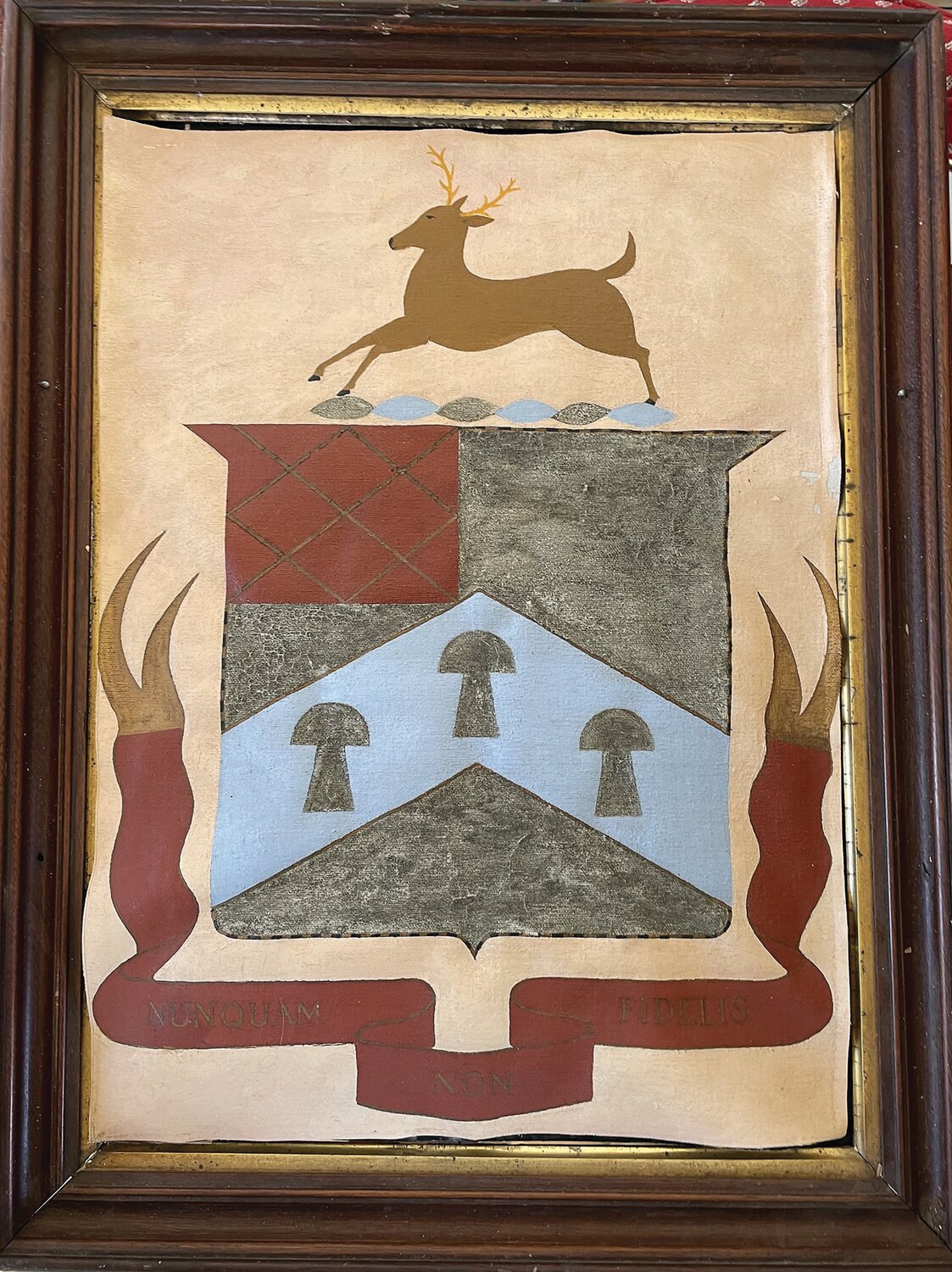 This hand-painted depiction of the Yardley family crest features a buck, haystacks, and the motto — “nunquam non fidelis” meaning “nothing if not faithful.”