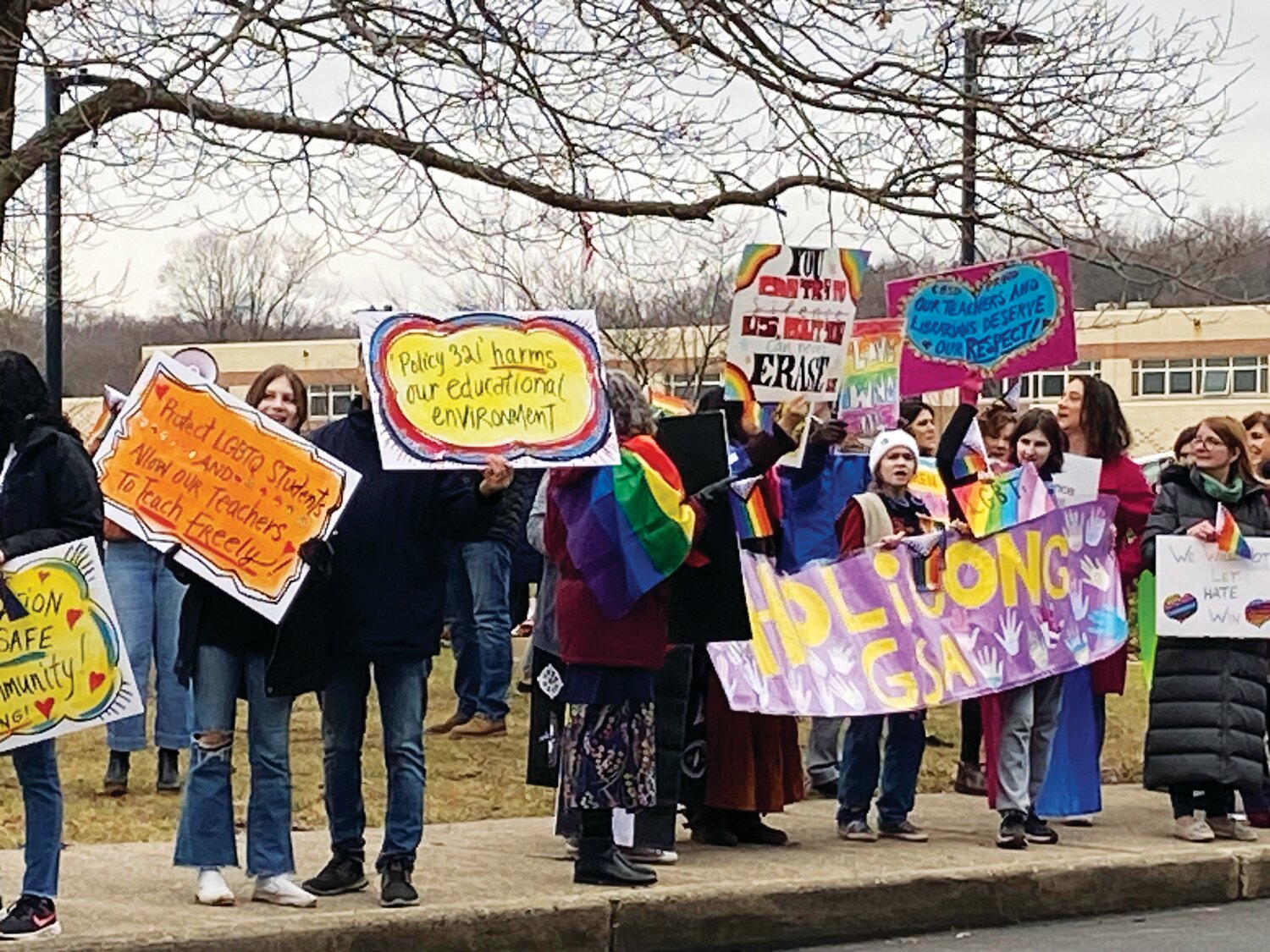 Protesters gather outside Central Bucks East High School in January to show unity and call for an end to a new district policy that requires Pride flags and other items be removed from classrooms.
