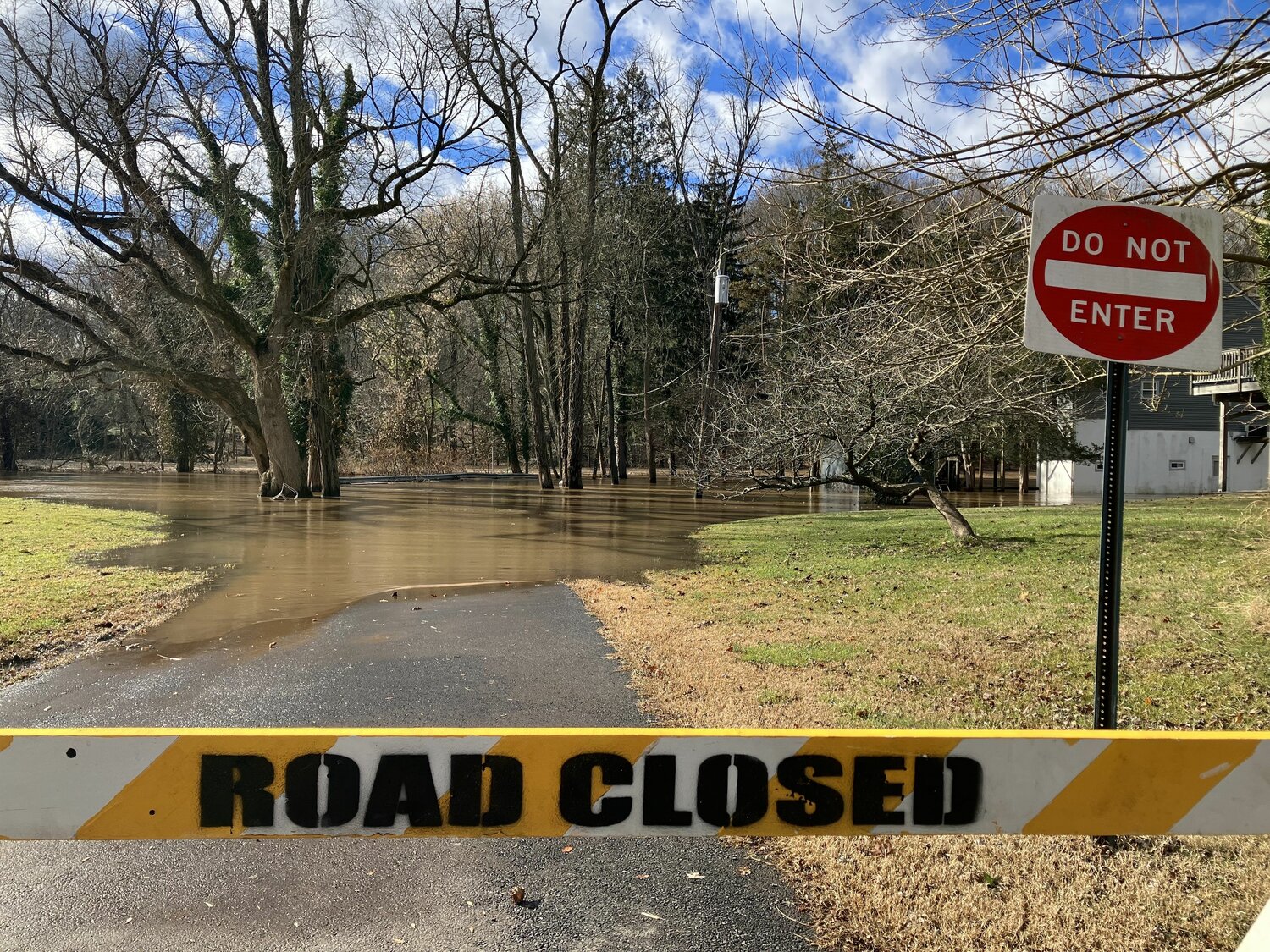 Mistletoe Drive on the banks of the Neshaminy Creek in Middletown Township is flooded after rain deluges the area Tuesday into Wednesday.