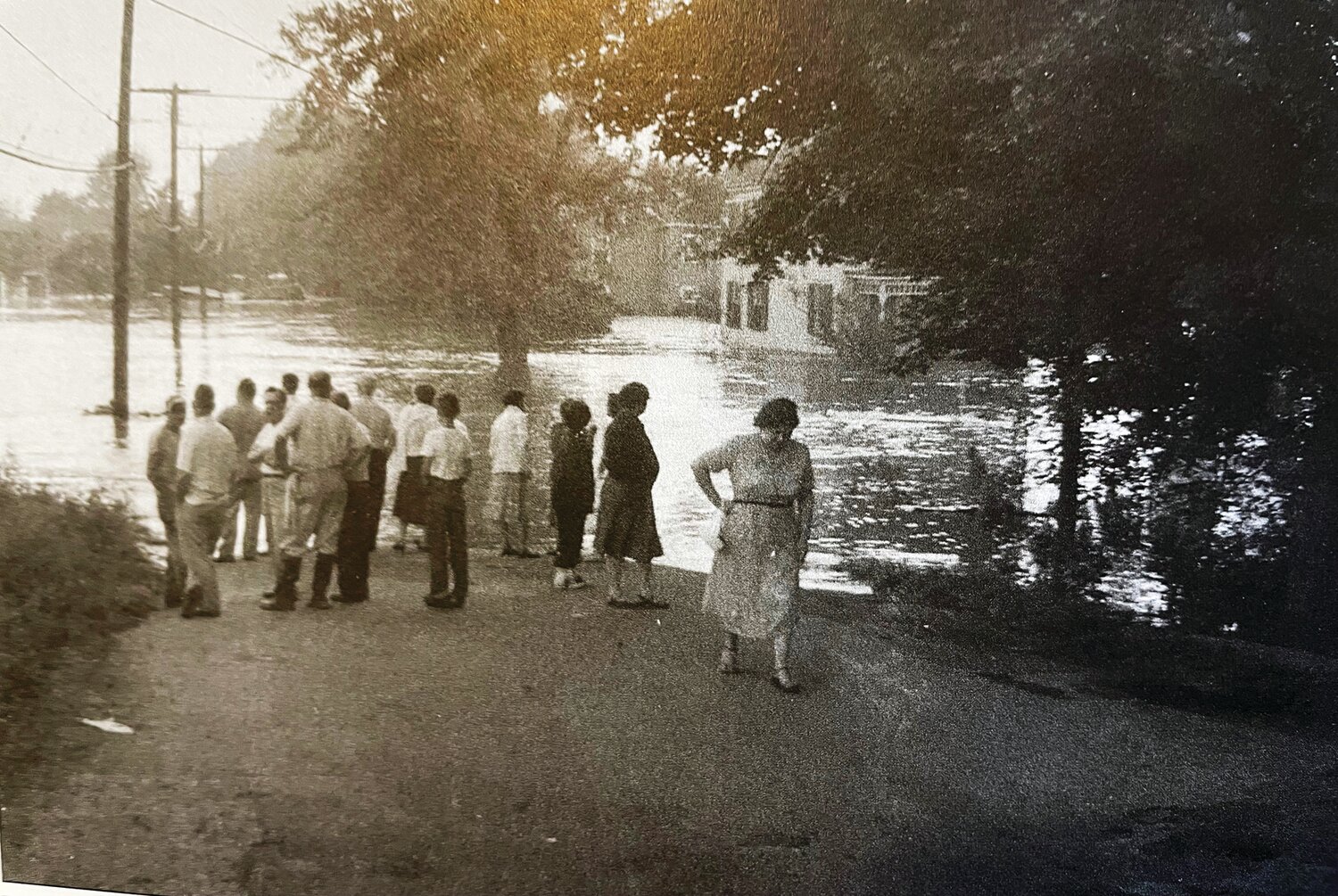 From atop a high canal bridge, residents looked down at their neighborhood during the Great Flood of 1955.