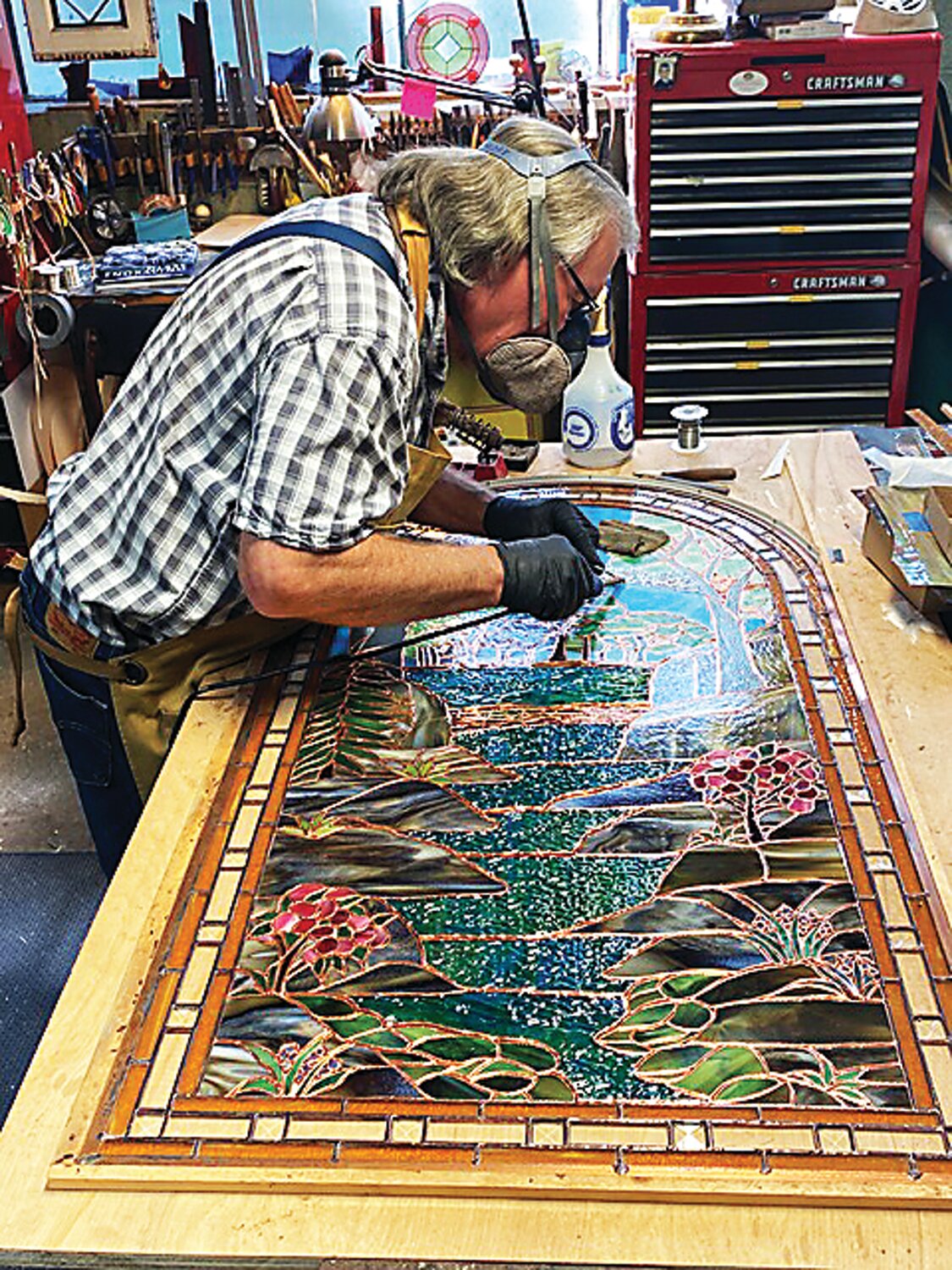 Geoff Caldwell works on a stained glass window. Caldwell is the lead craftsman at Sunflower Glass Studio in Stockton.