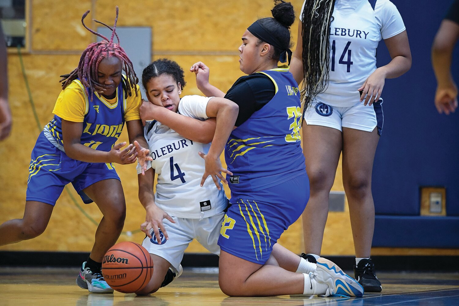 Solebury’s Tyler Joseph gets sandwiched between City’s Ny’gie Young and Kaylee Suarez while chasing a loose rebound.