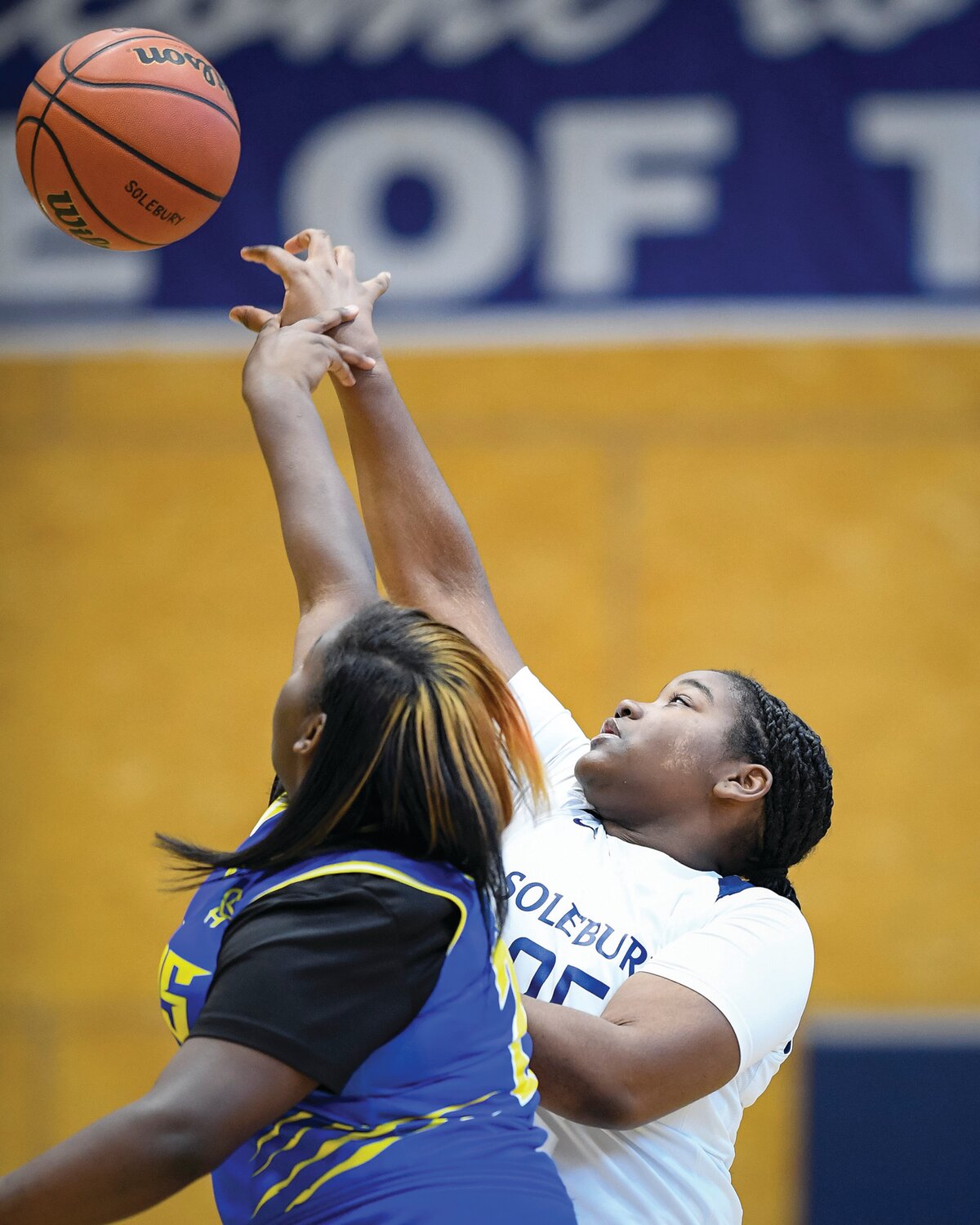 Solebury School’s Autumn Turner and The City School’s Maiya Porter during the opening tipoff.