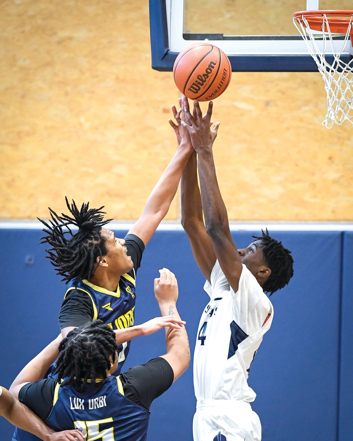 Solebury School’s Messiah Barton beats The City School’s Shawn Murphy to a rebound in the first half.