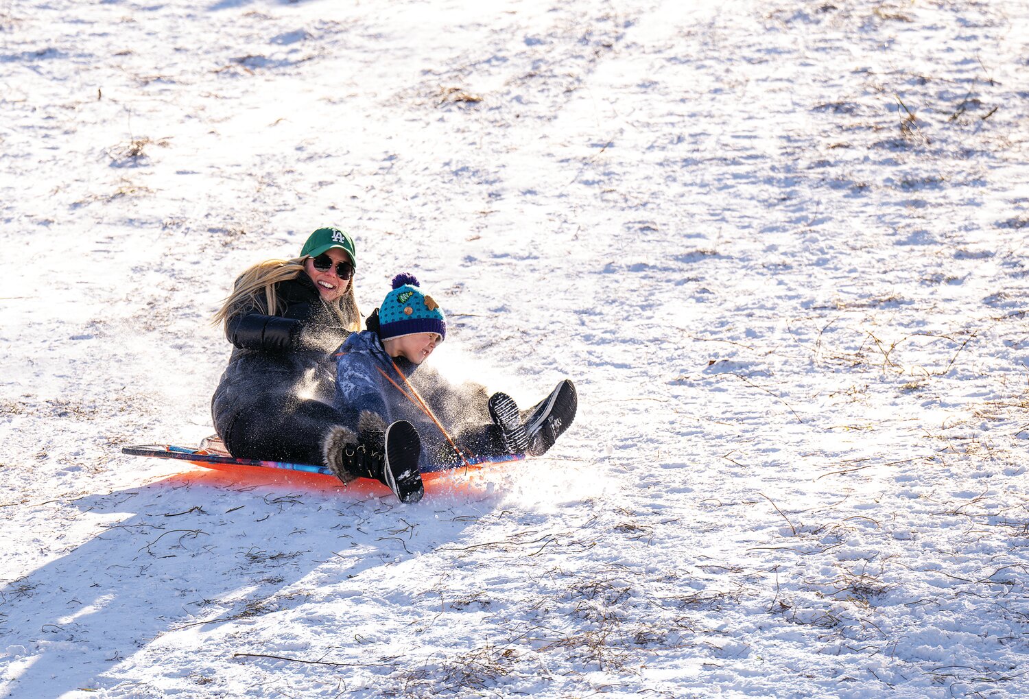 Sledders at Magill’s Hill Park in Solebury take advantage of the winter weather.