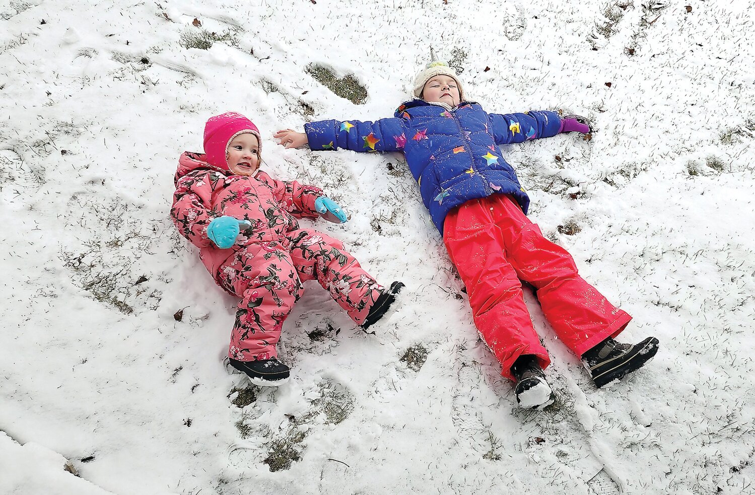 Mia and Baylee White, of Perkasie, found that a Jan. 6 storm dropped just enough of the white stuff to make snow angels.