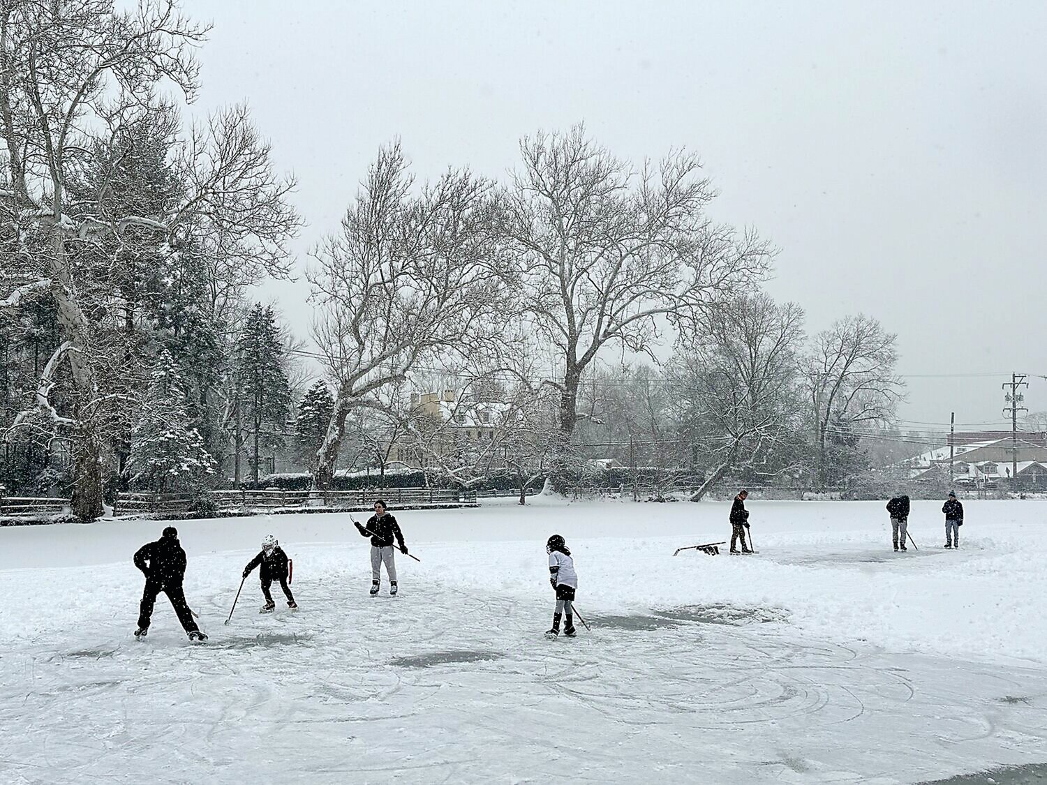 Frozen-over Lake Afton, in Yardley, became a makeshift ice hockey rink Jan. 19 as local children laced up their skates and enjoyed an unexpected day off from school.