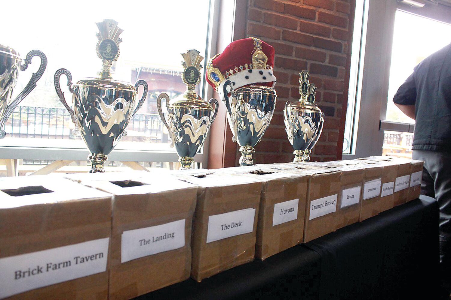 Chili Cook-off trophies and ballot boxes line the wall during last year’s event.