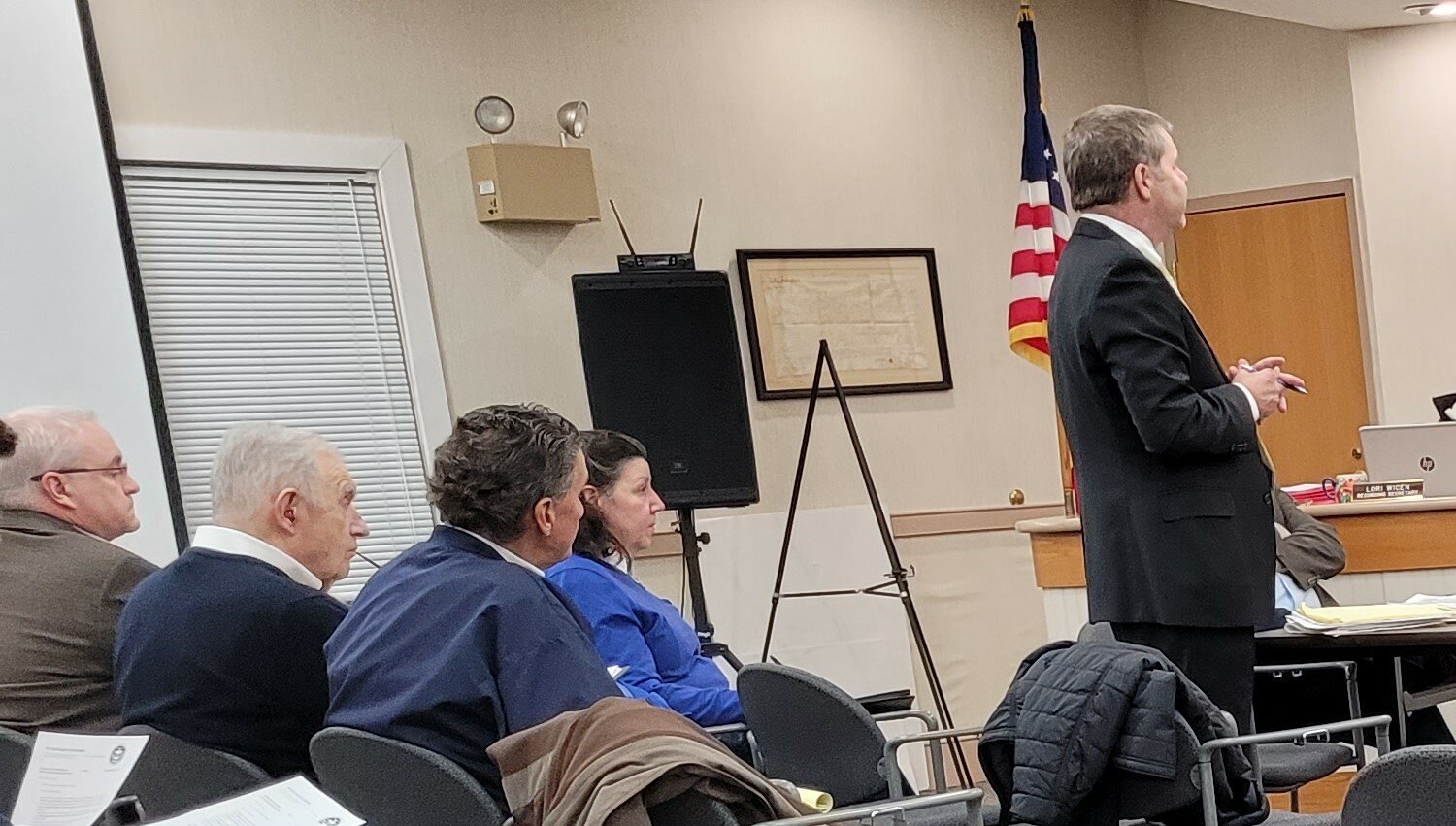 Fred Beans, center left, sits in the audience as his proposal to build a car dealership near the PA Biotech Center is discussed during a Jan. 24 meeting of the Buckingham Township Board of Supervisors. Supervisors ultimately green-lighted the proposal.