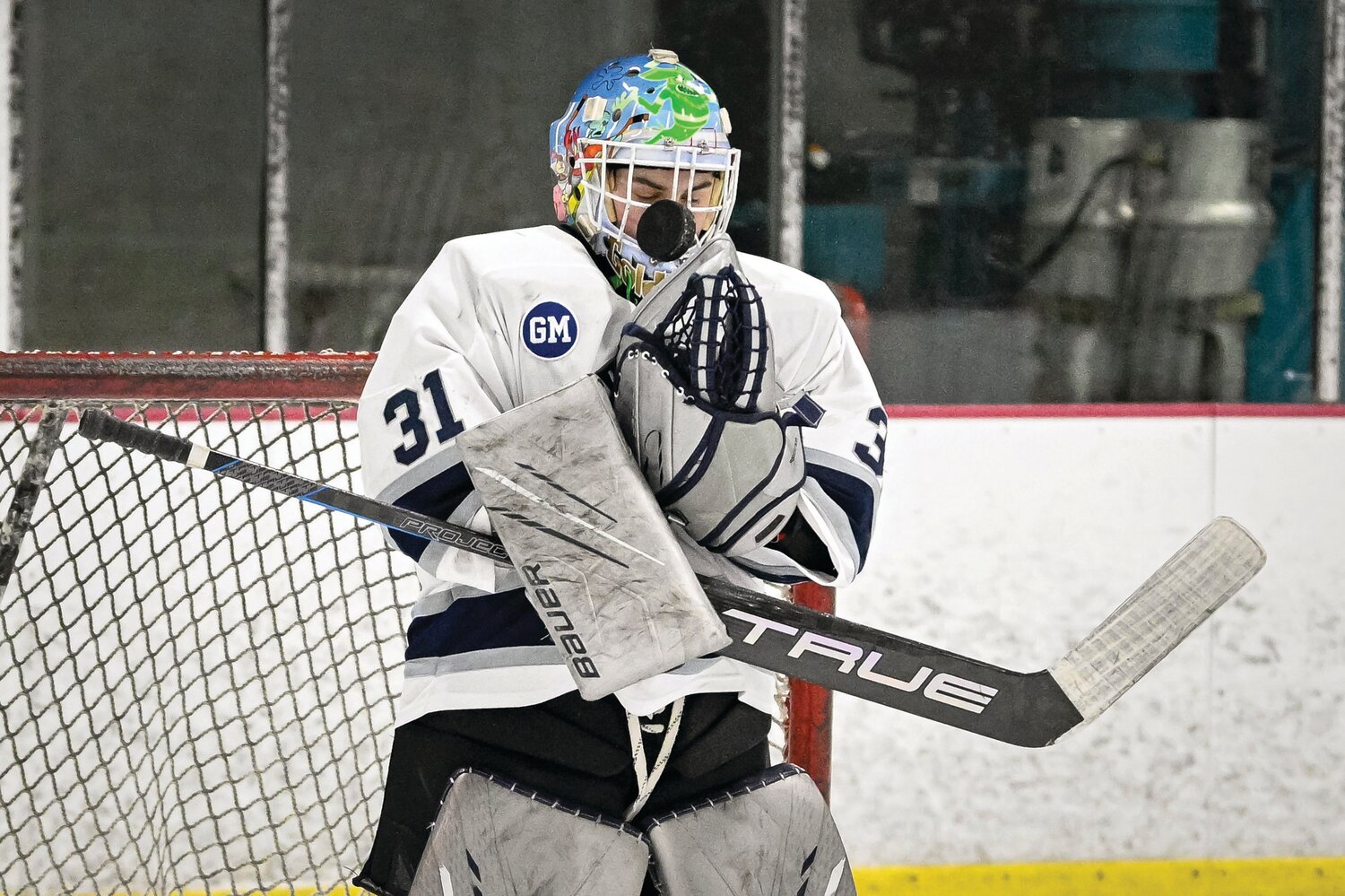 Council Rock North goalie Ian Goldberg stops a shot up in his mask during the third period of last Wednesday’s game against Pennsbury.