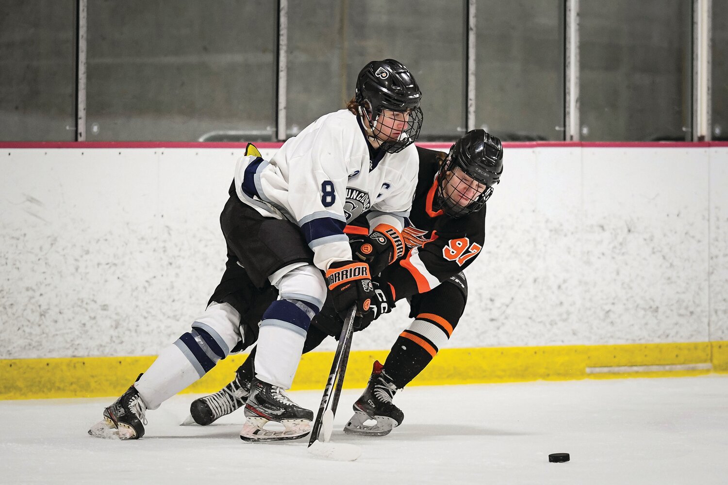 Council Rock North’s Nicholas Hahn and Pennsbury’s Connor Gray battle for the puck.