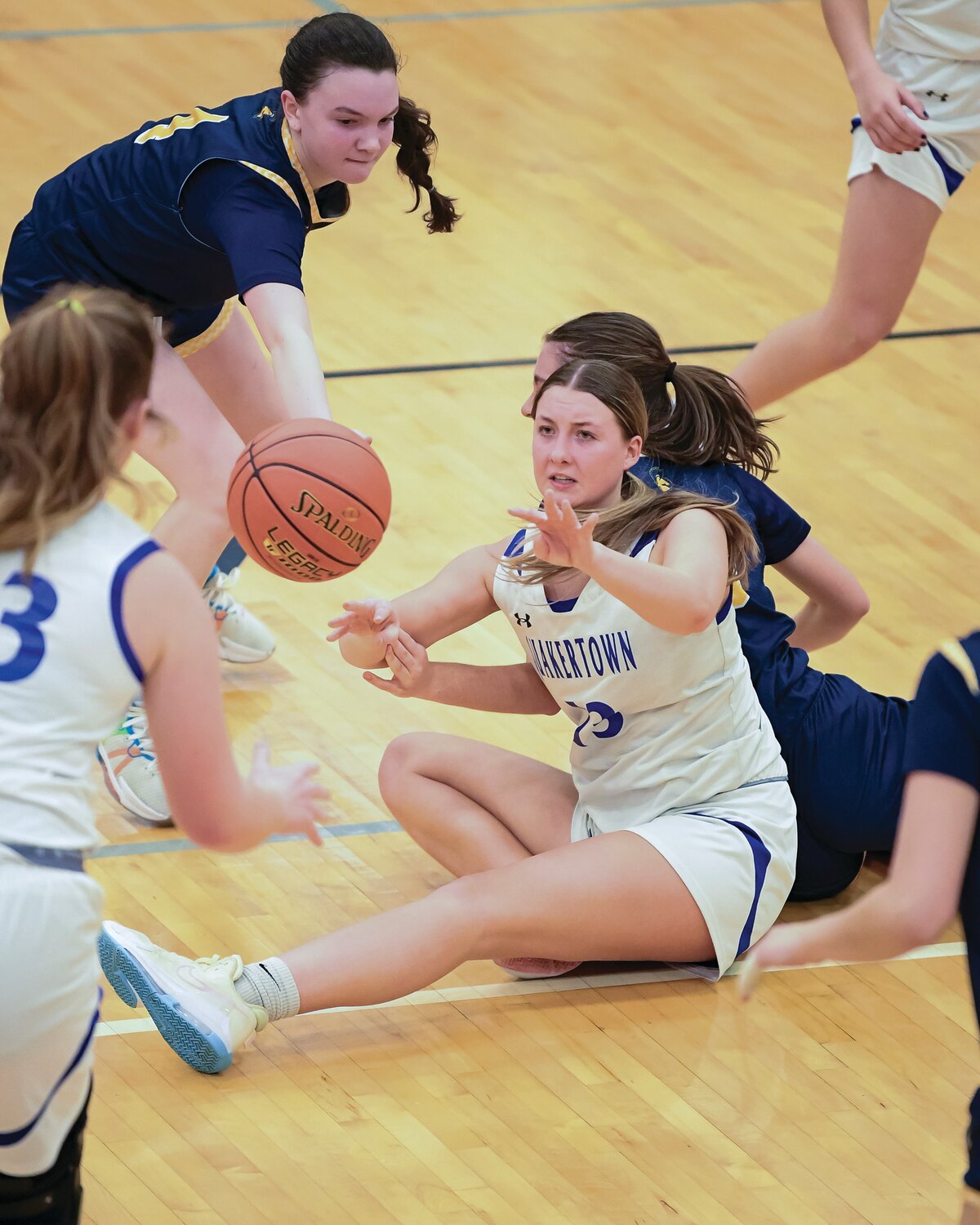 Quakertown’s Addyson Davis gets off a pass after scrambling for a loose ball in the third quarter.