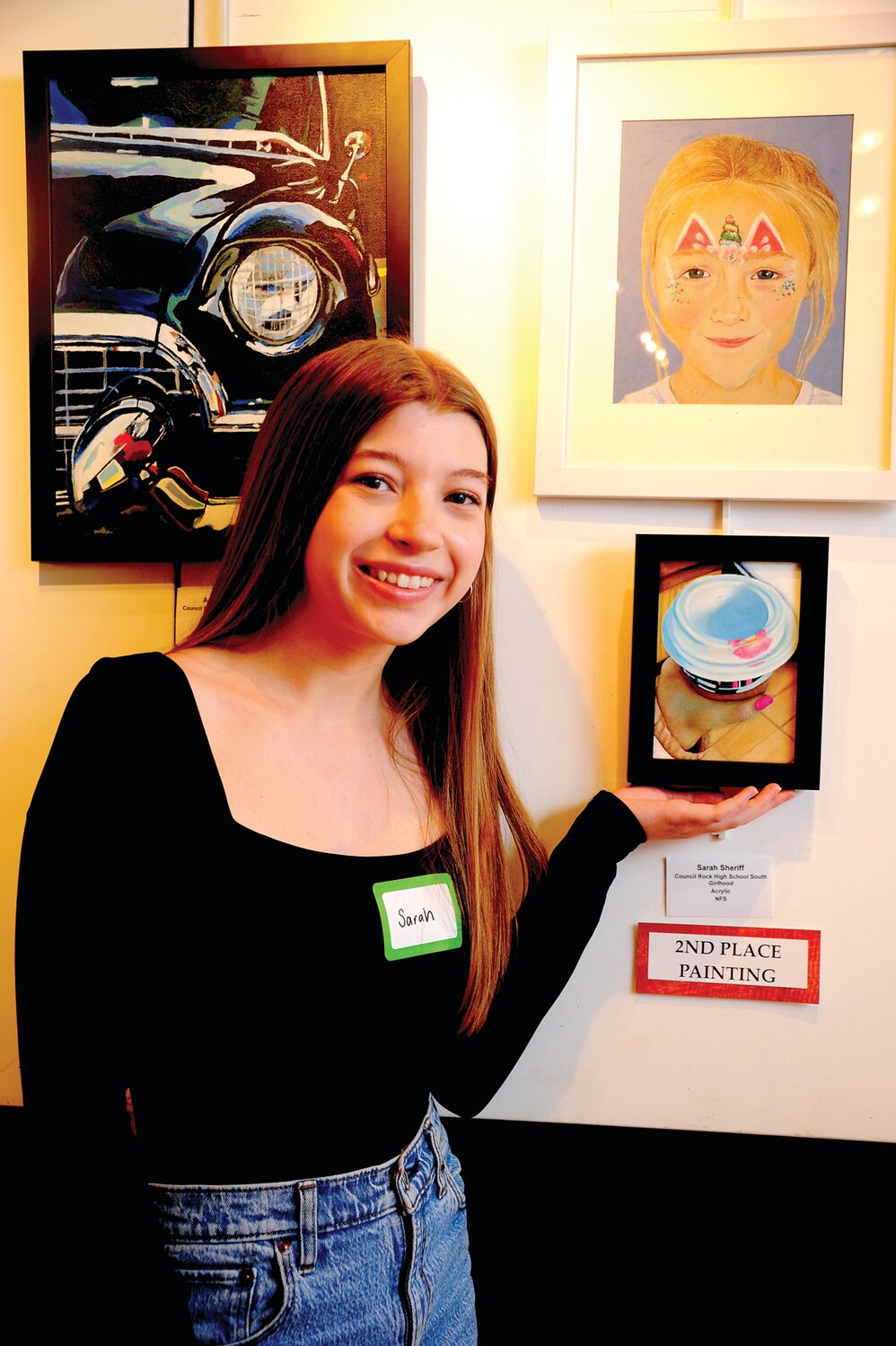 Sarah Sheriff with her second-place painting “Girlhood.”