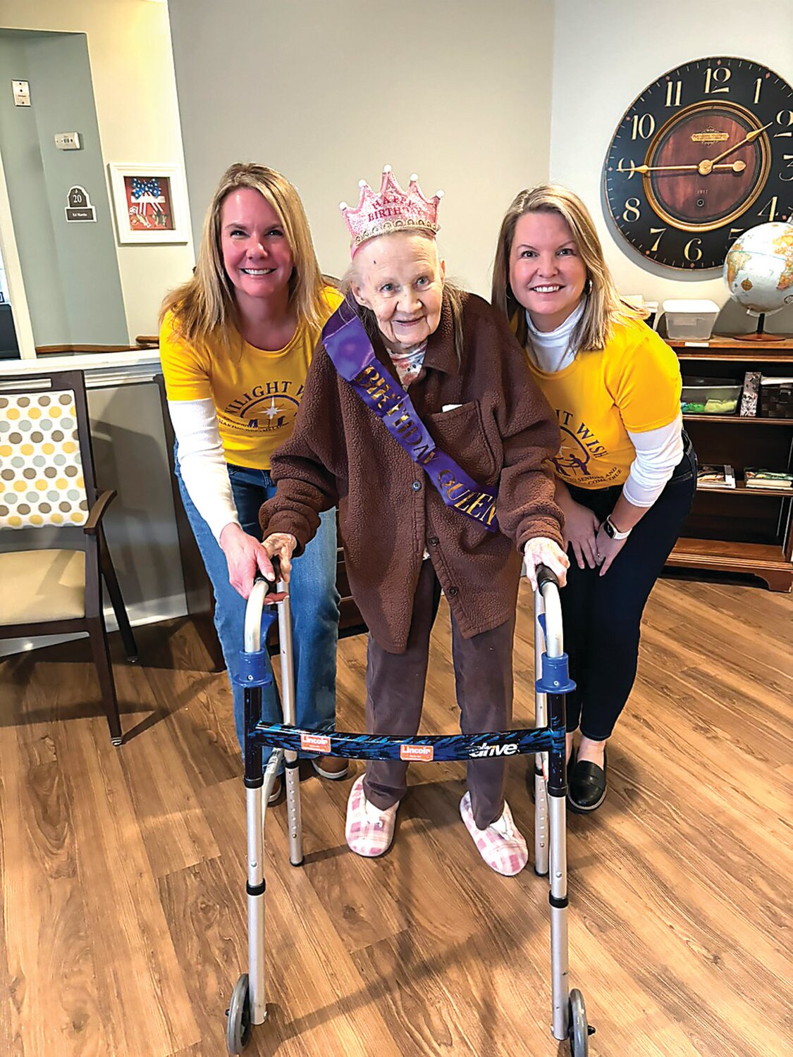 Birthday girl Frances Mollyn, center, smiles with representatives from the Twilight Wish Foundation, Mary Farrell, left, and Cheryl Gustafson, right, during a celebration of her 100th birthday.